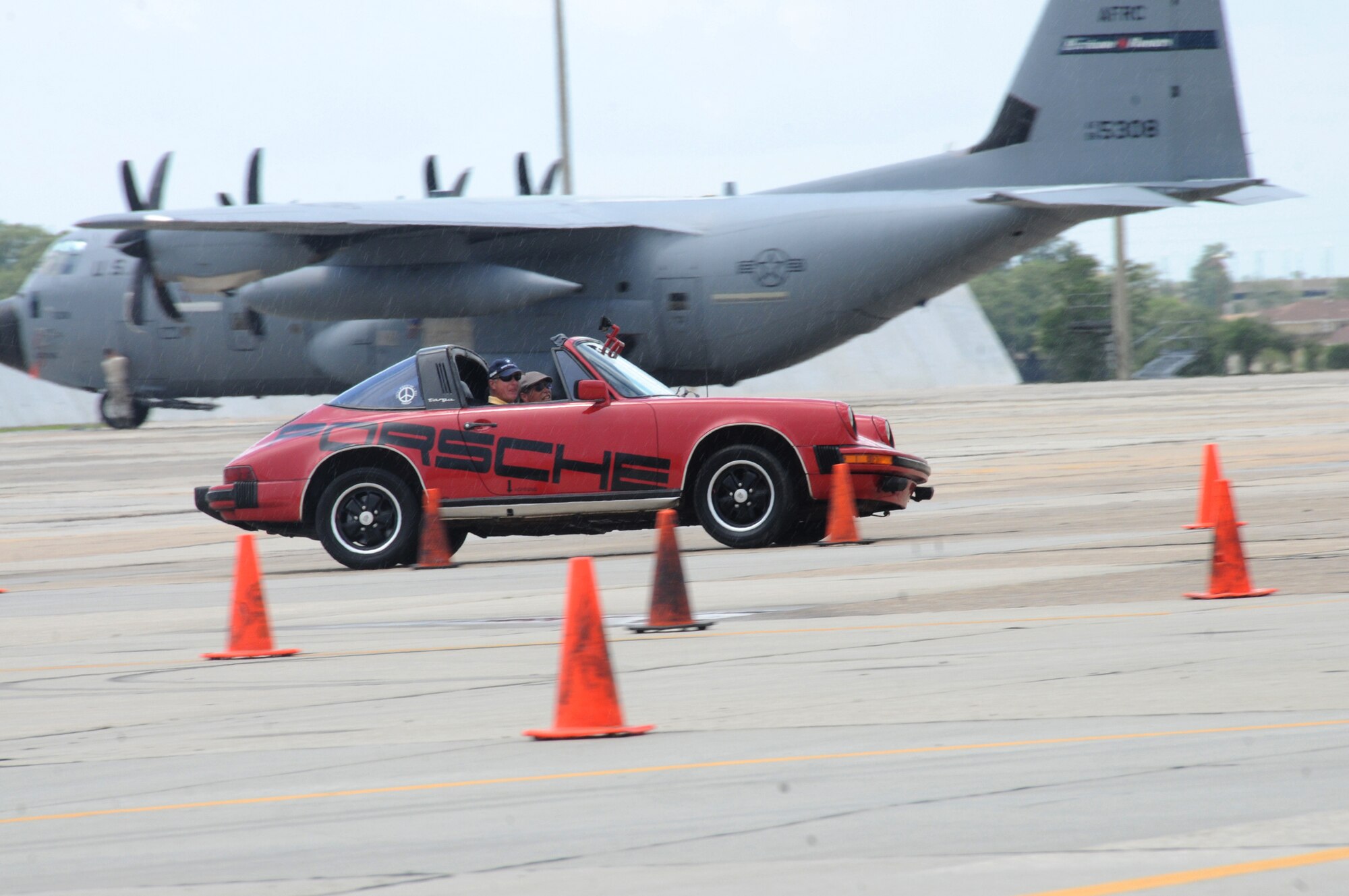 Rusty Noonan, instructor from the Gulf Coast Region of the Sports Car Club of America, escorts Kirby Gentry, driver, through the course set up for the two-day  street survival and defensive driving class on the flight line June 23, 2012, Keesler Air Force Base, Miss.  The students spent the first few hours receiving briefings and the rest of the course was dedicated to hands-on practice on the flight line.  (U.S. Air Force photo by Kemberly Groue)