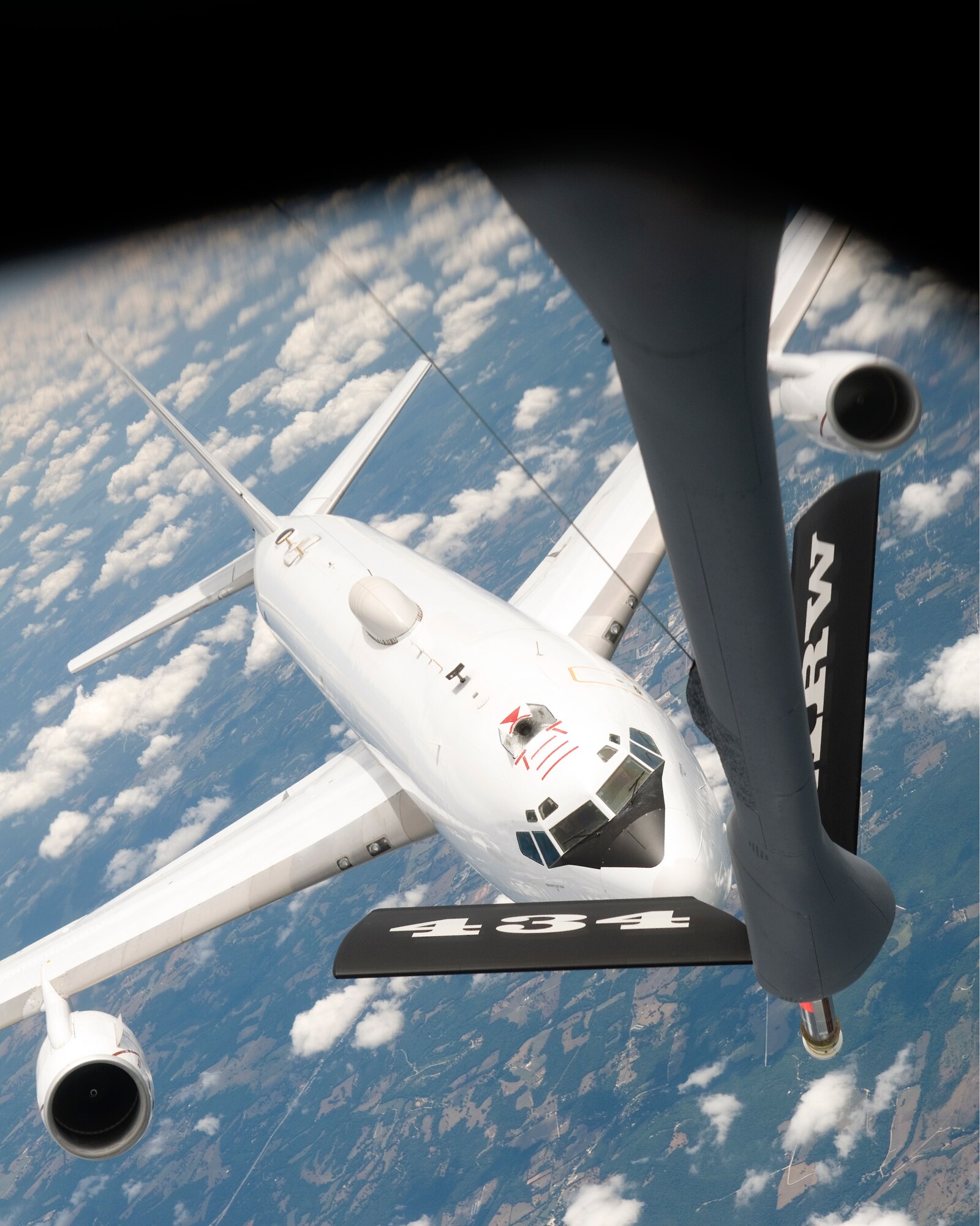 GRISSOM AIR RESERVE BASE, Ind. -- A KC-135R Stratotanker with the 434th Air Refueling Wing, meets with a Navy E-6B Mercury from Tinker Air Force Base, Okla., to perform an aerial refueling June 20. Grissom honorary commanders and local civic leaders flew aboard the KC-135R to learn about the mission of the 434th ARW. (U.S. Air Force photo/Senior Airman Andrew McLaughlin)