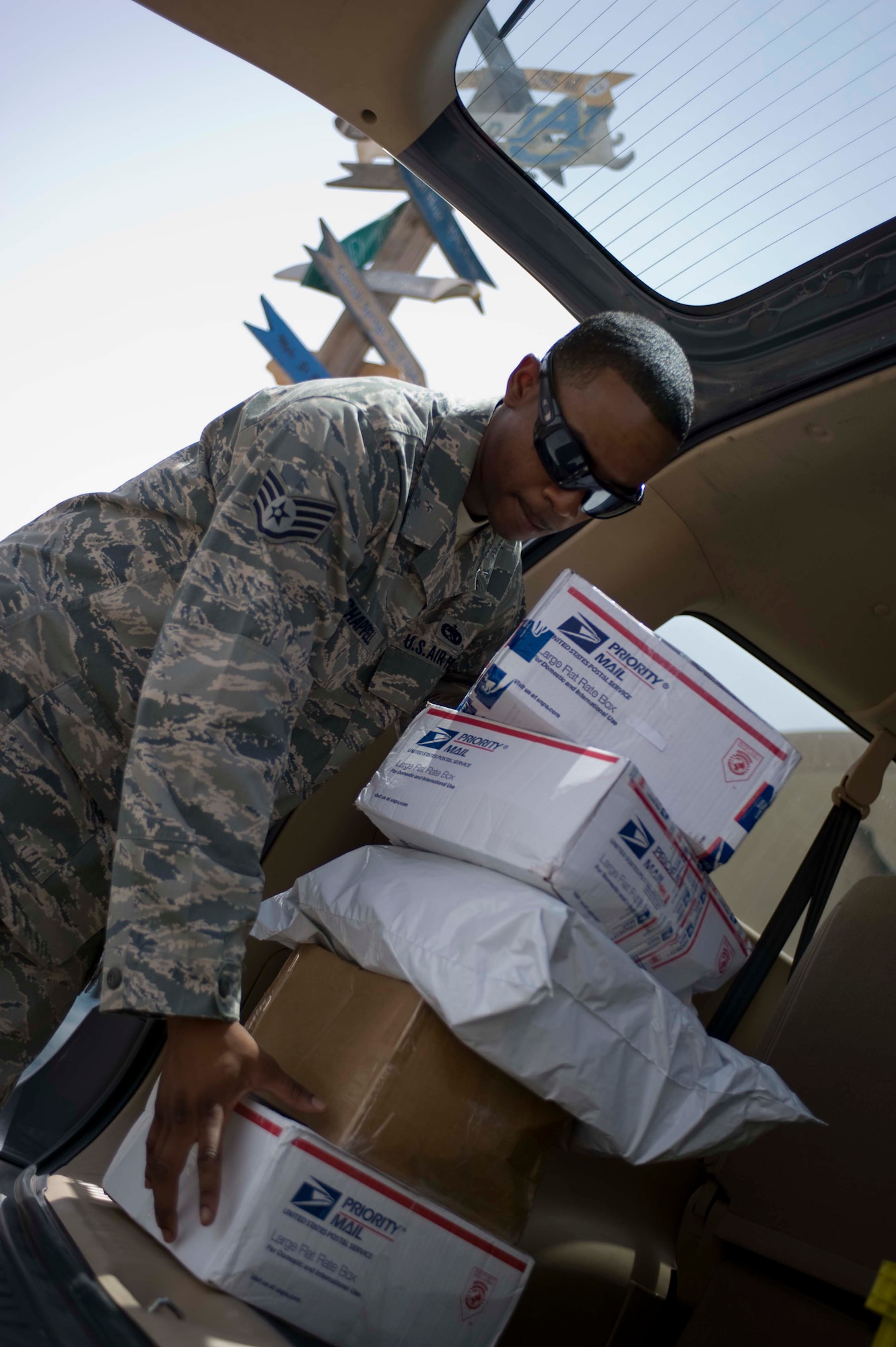 U.S. Air Force Staff Sgt. Gary Chappell, 379th Expeditionary Aircraft Maintenance Squadron mail clerk, prepares to carry mail before delivering off the packages to his unit in Southwest Asia, June 27, 2012. There are more than 100 mail clerks throughout the base authorized  to pick up mail at the Post Office that handles an average of 300 to 400 packages a day. Chappell is deployed from the 2nd Maintenance Squadron, Barksdale Air Force Base, La., and a native of Roxboro, N.C. (U.S. Air Force photo/Staff Sgt.Sheila deVera)
