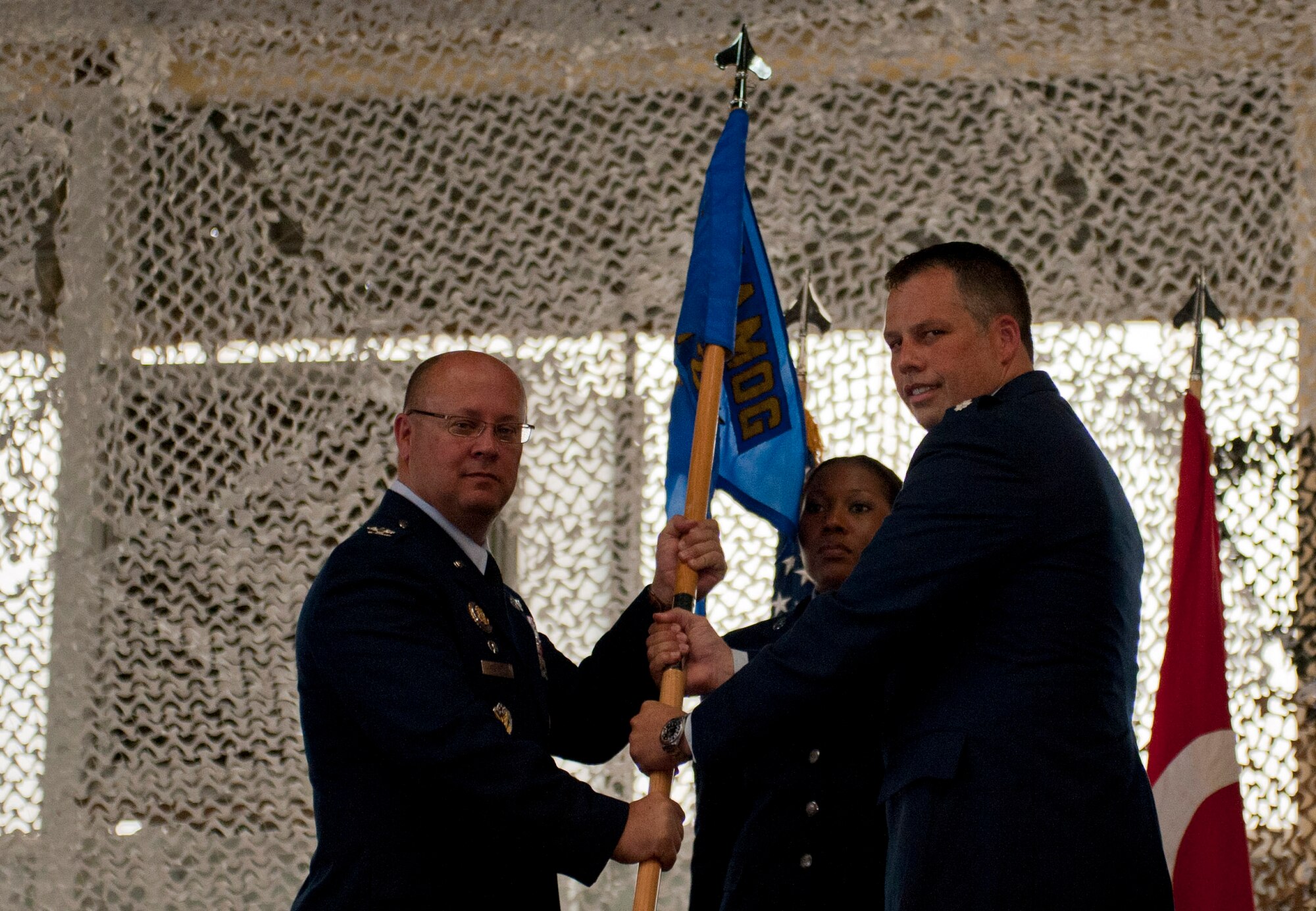 Lt. Col. Henry Triplett III, incoming 728th Air Mobility Squadron commander, assumes command of the 728th AMS from Col. James Regenor, 521st Air Mobility Group commander, during the change-of-command ceremony June 27, 2012 at Incirlik Air Base, Turkey. Triplett now commands the 728th AMS, which provides strategic, theater and contract commercial air mobility support in the Eastern Mediterranean region. (U.S. Air Force photo by Senior Airman Anthony Sanchelli/Released) 
