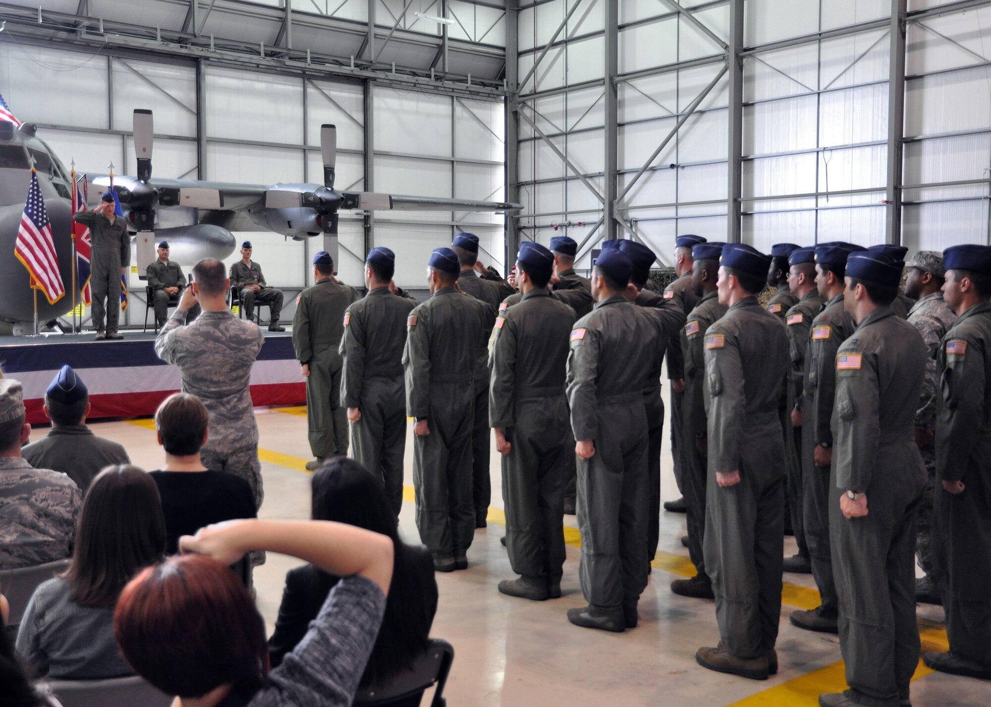 RAF MILDENHALL, England – Lt. Col. William Clay Freeman, 7th Special Operations Squadron commander, receives his first salute from his unit after assuming command of the Airmen in a ceremony in Hangar 803 here June 22, 2012. Freeman previously served as the unit's director of operations.  (U.S. Air Force photo/Staff Sgt. Thomas Trower)