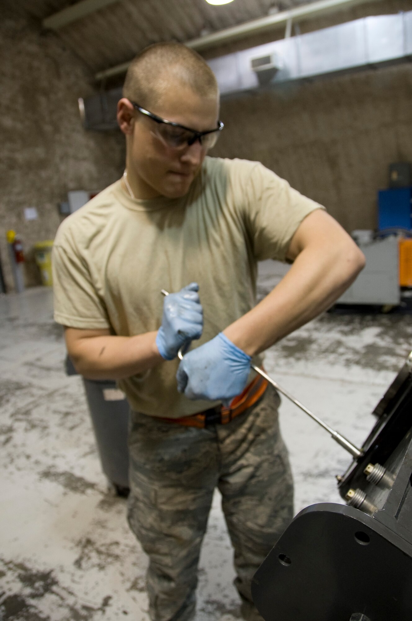 Senior Airman Anthony Gugino, 379th Propulsion Centralized Repair Facility technician, begins the breakdown process on some of the small parts of a C-130 Hercules propeller here June 27, 2012. A new process has been implemented which drastically cuts down on propeller maintenance for the C-130 Hercules. (U.S. Air Force photo/Senior Airman Bryan Swink)