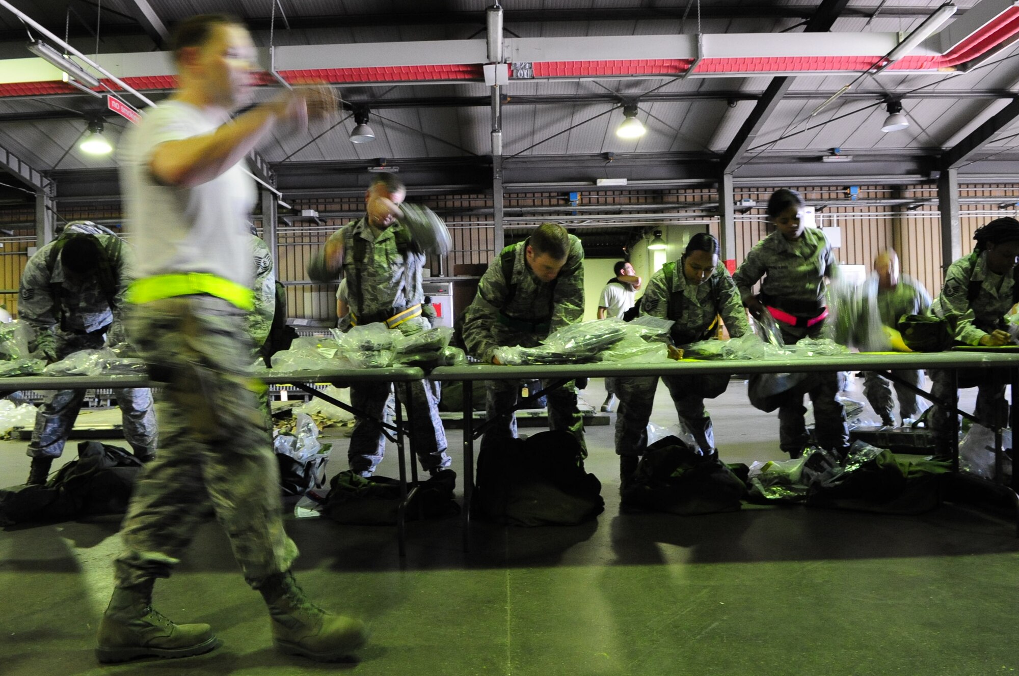 Members of the 31st Fighter Wing take an inventory of their mobility bags in preparation for a simulated deployment as part of a local readiness exercise at Aviano Air Base June 18. During the LRE, members were evaluated on their ability to deploy in support of contingencies at a moment’s notice. (U.S. Air Force photo/Staff Sgt. Evelyn Chavez)