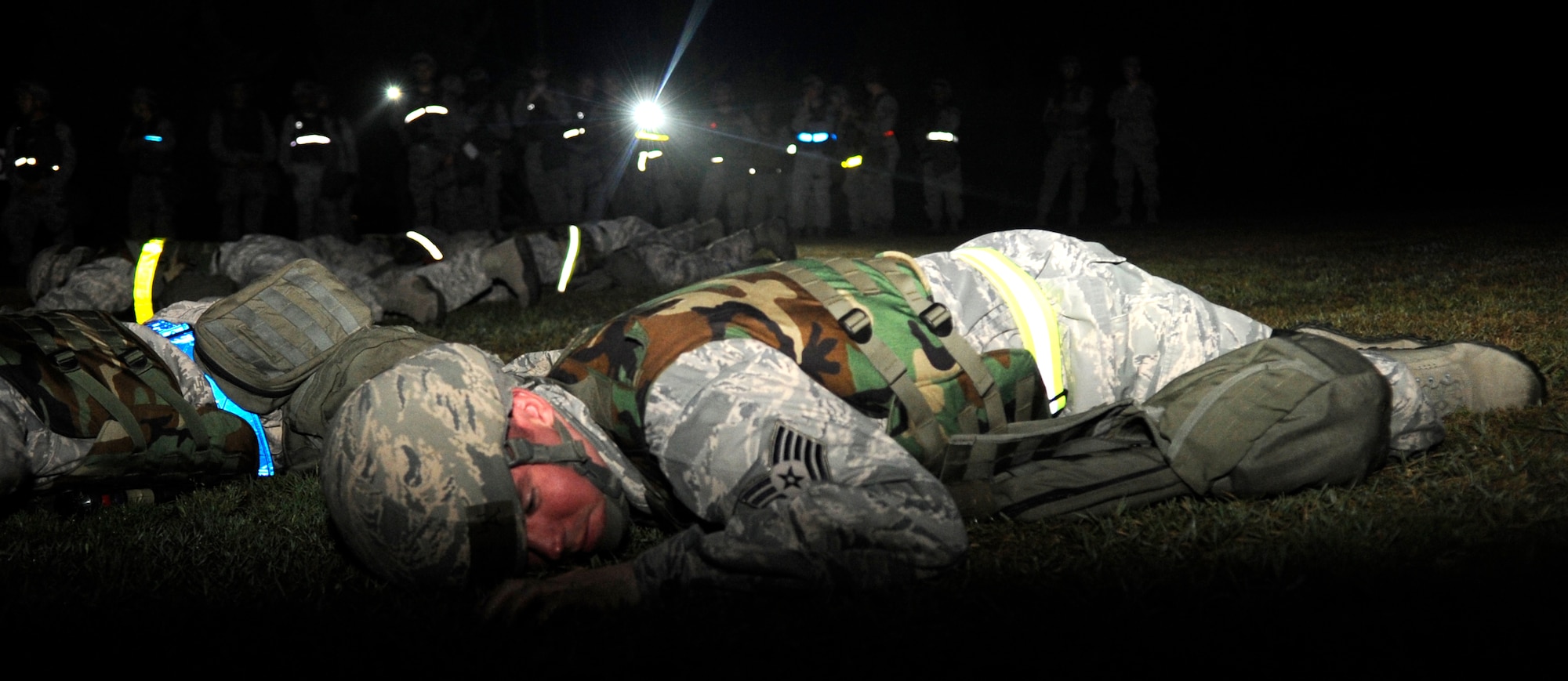 An Airman from the 8th Civil Engineer Squadron practices ground maneuvers during PRIME Beef training June 21, 2012, at Kunsan Air Base, Republic of Korea. They learned different techniques that allow them to move as silently as possible during nighttime contingency operations. (U.S. Air Force photo/Senior Airman Brigitte N. Brantley)