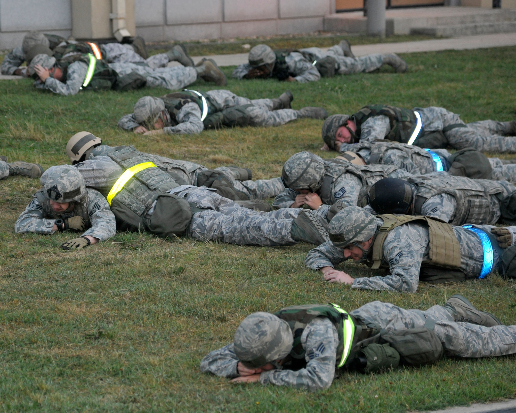 Airmen from the 8th Civil Engineer Squadron Charlie flight simulate their reaction time to an enemy flare during nighttime operations at Kunsan Air Base, Republic of Korea, June 21, 2012. The training they receive is used to lessen the loss of their “night eyes” when a flare is used. (U.S. Air Force photo/Senior Airman Marcus Morris)