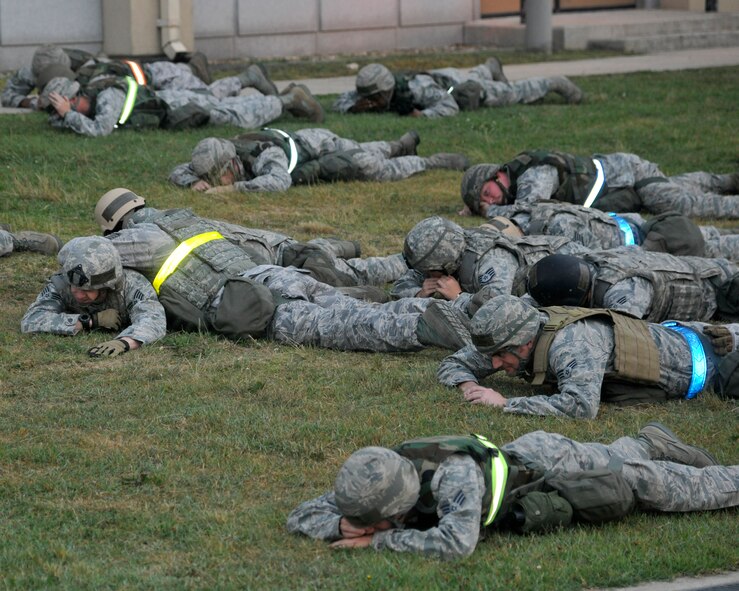 Airmen from the 8th Civil Engineer Squadron Charlie flight simulate their reaction time to an enemy flare during nighttime operations at Kunsan Air Base, Republic of Korea, June 21, 2012. The training they receive is used to lessen the loss of their “night eyes” when a flare is used. (U.S. Air Force photo/Senior Airman Marcus Morris)