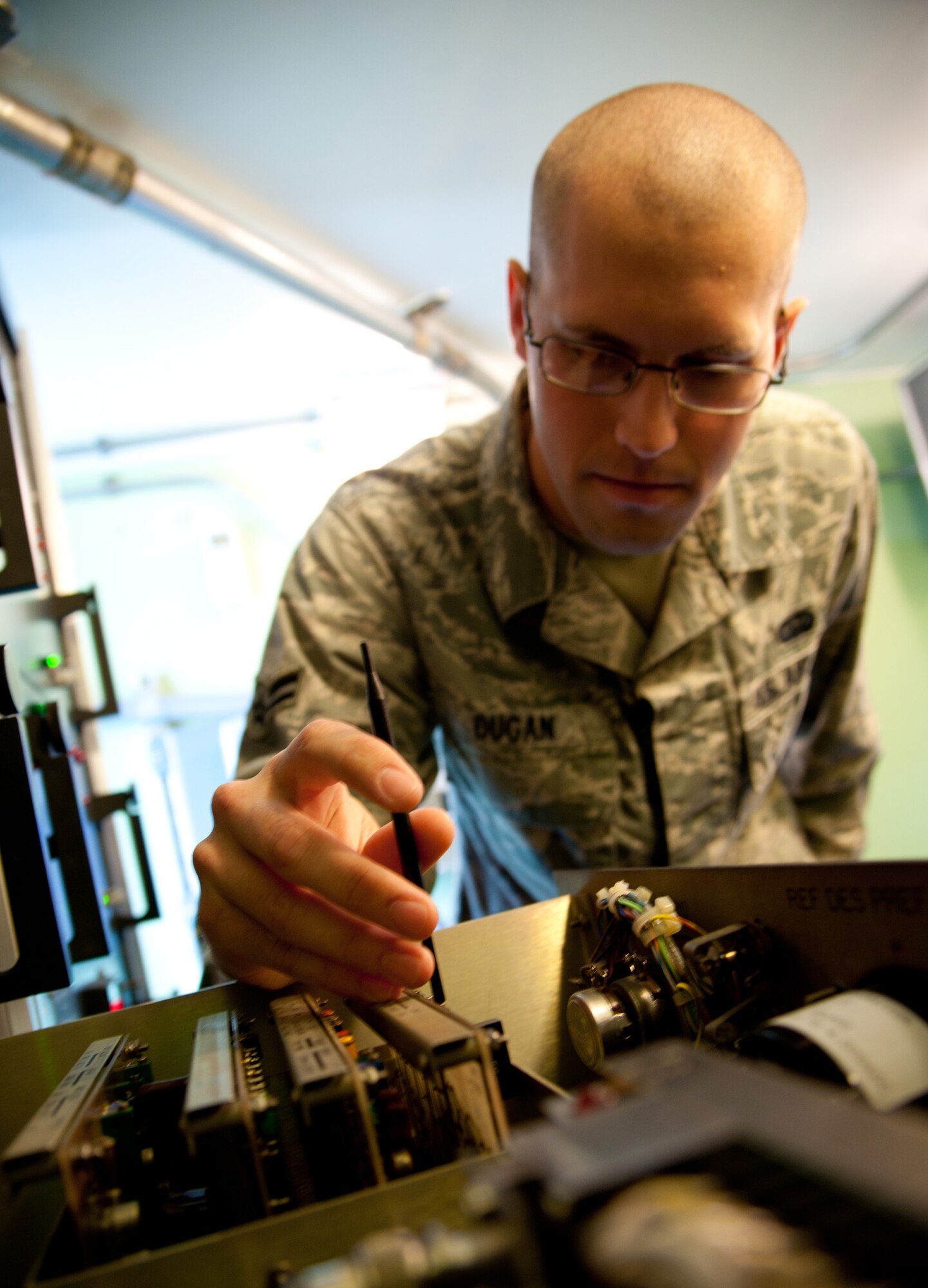 YOKOTA AIR BASE, Japan -- Airman 1st Class Lucas Dugan, 374th Communication Squadron airfield systems technician, calibrates a circuit board from an instrument landing system localizer at Yokota Air Base, Japan, June 25, 2012.  The localizer is a navigational system that allows pilots to find the center of the runway at Yokota, even in the worst weather conditions. If the equipment is not calibrated correctly, the pilot could land off the runway, possibly costing the lives of their passengers. (U.S. Air Force photo by Staff Sgt. Shawn Rhodes)