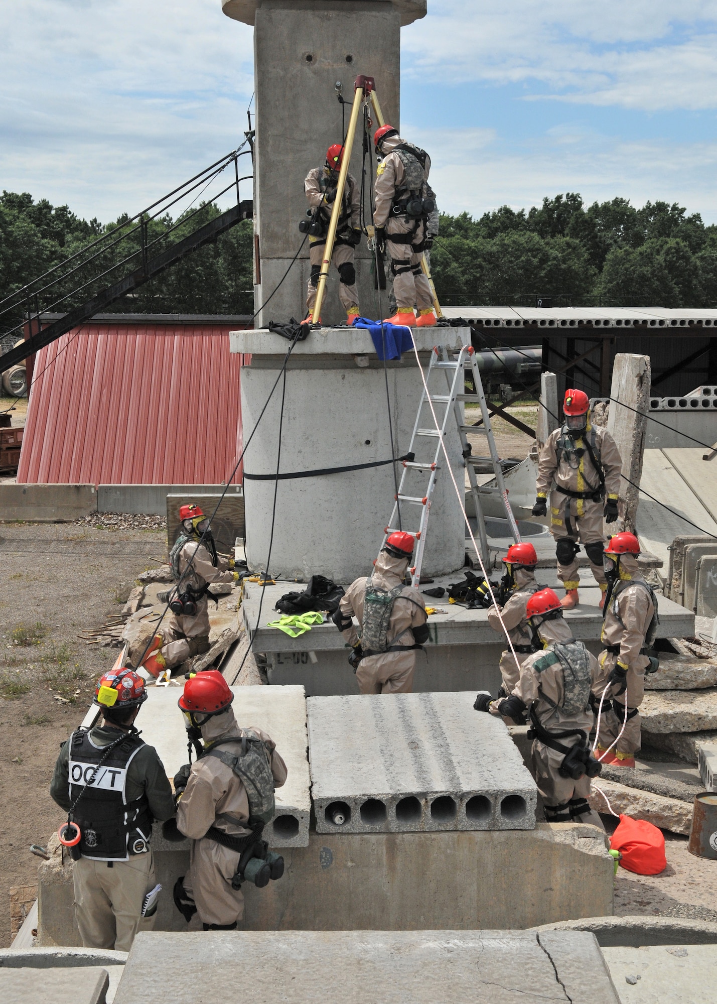 Members of the Wisconsin Chemical, Biological, Radiological, Nuclear, and high Explosive Enhanced Response Force Package (CERFP) extract a casualty from a confined space during a June 13 training exercise at Volk Field Combat Readiness Training Center. Wisconsin is the 18th state to obtain the CERFP certification. The team, comprised of members of the Wisconsin Air and Army National Guard, provides search and rescue, decontamination and medical support in the event of natural or man-made disasters. 115th Fighter Wing photo by Airman 1st Class Andrea F. Liechti  