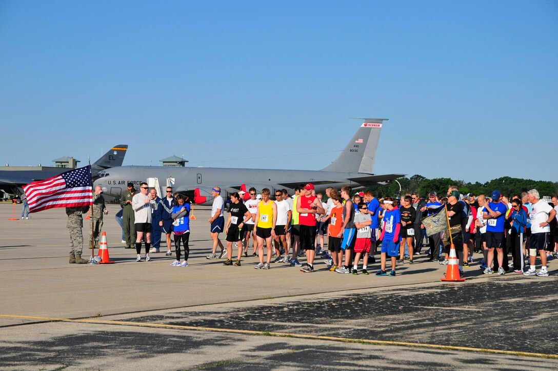The runners gather at the starting line for the Volk Field 5K runway run.  Photo by Joe Oliva, Jetpix.com
