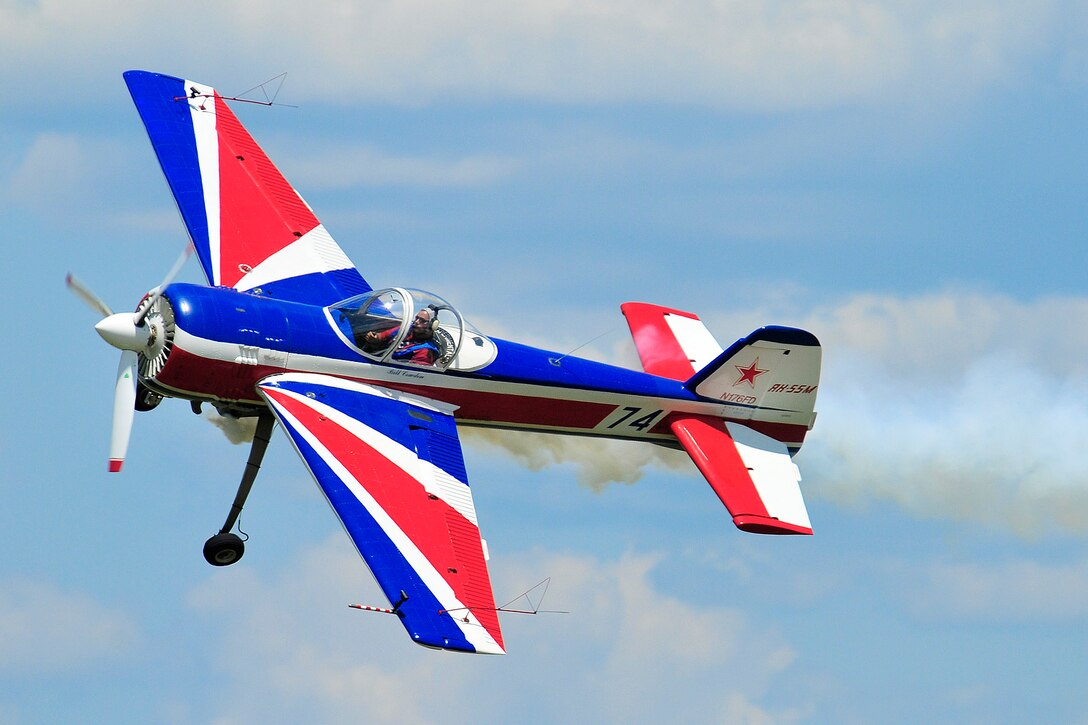 Aerobatic pilot Bill Cowden does a photo pass for the crowd as part of his performance in the Yak-55M aircraft.  Photo by Joe Oliva, Jetpix.com