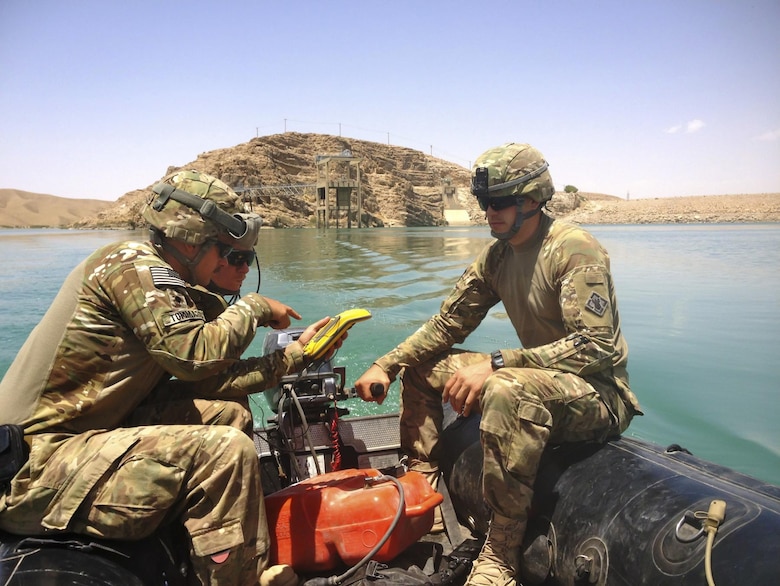 AFGHANISTAN — Spc. Matthew Tommaso (left), Staff Sgt. Bryan Crowley (center), and 1st Lt. Michael Jappe (right) conduct a hydrographic survey at Kajaki Dam. The soldiers are members of 569th Engineer Dive Detachment, which deployed to Afghanistan to support the U.S. Army Corps of Engineers Afghanistan Engineer District-South, by conducting hydrographical surveys and inspections of underwater structures at Kajaki and Dahla Dams.