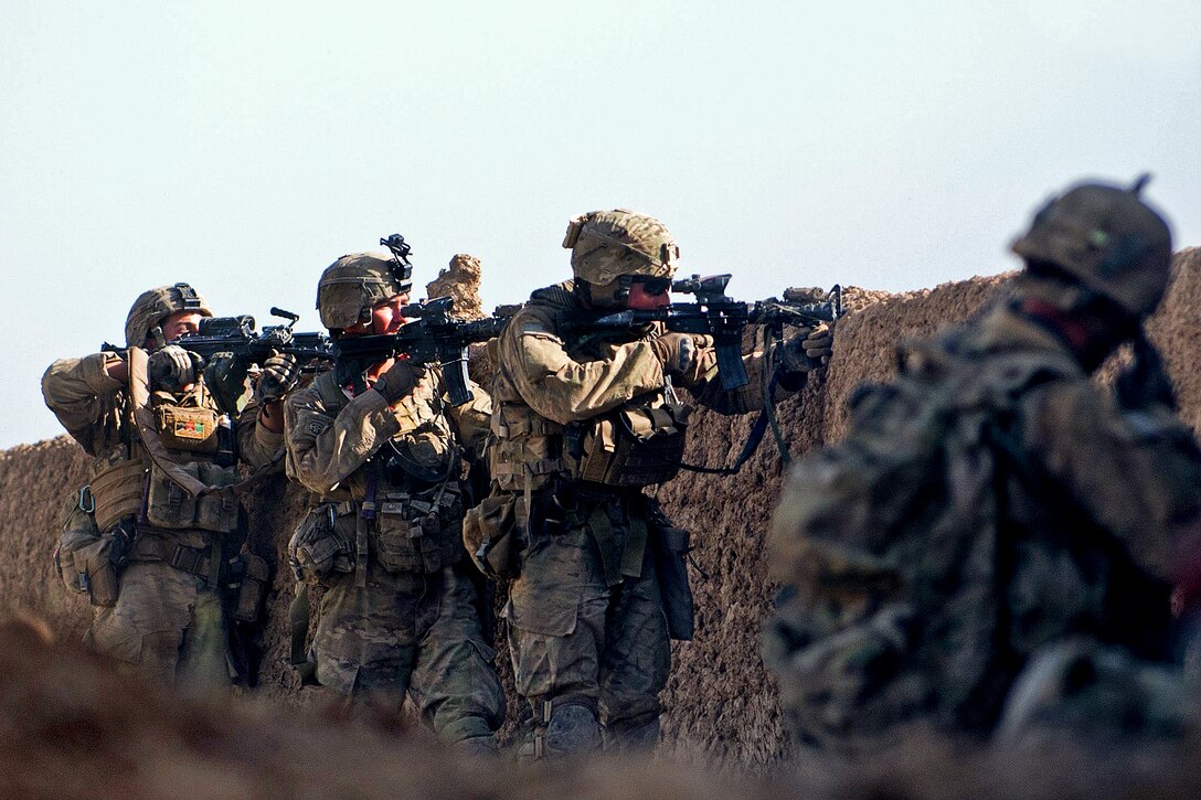 U.S. paratroopers fire at insurgent forces during a firefight on the outskirts of Spedar village in southern Afghanistan's Ghazni province, June 15, 2012. This was the first of several firefights U.S. and Afghan soldiers encountered during their daylong partnered patrol. The soldiers are assigned to the 82nd Airborne Division's Company D, 1st Battalion, 504th Parachute Infantry Regiment, 1st Brigade Combat Team.