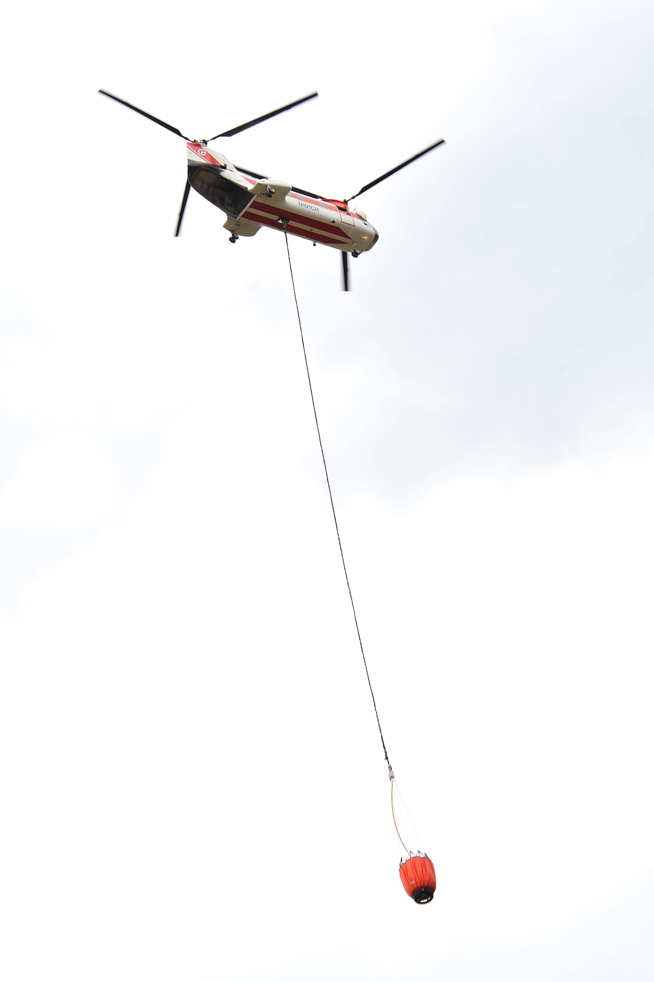 A helicopter prepares to dump water on the Waldo Canyon Fire June 28, Air Force Academy, Colo. The Waldo Canyon fire has destroyed more than 18,000 acres in the Colorado Springs area. (U.S. Air Force photo by Staff Sgt. Christopher Boitz)