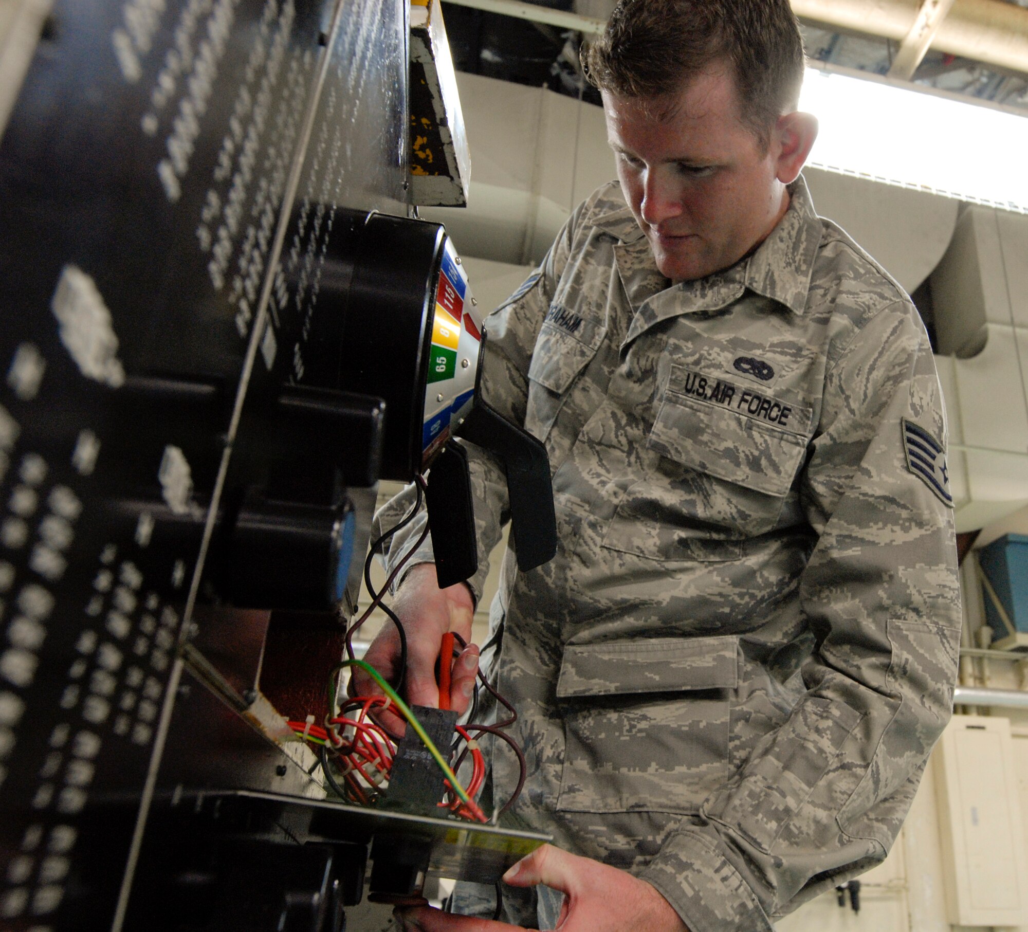 Staff Sgt. Charles Graham, Air Force repair enhancement program technician, fixes a metal lathe at the Maintenance Group on Kadena Air Base, Japan, June 15, 2012. The Air Force repair enhancement programs efforts helped save the Air Force $552,000 in 2011. (U.S. photo/Airman 1st Class Malia Jenkins) 