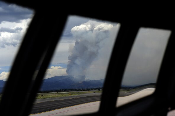 A smoke plume rises from the Waldo Canyon fire June 27, 2012. MAFFS crews responded to the blaze from Peterson Air Force Base beginning June 25. (U.S. Air Force photo/Staff Sgt. Stephany D. Richards) 

