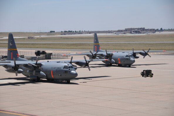 Wyoming Air National Guard Modular Airborne Fire Fighting System-equipped C-130s arrive in Colorado Springs, Colo. Airmen assigned to the 153rd Airlift Wing, Cheyenne, Wyo., arrived at Peterson Air Force Base, Colo., to provide support to ongoing Colorado firefighting efforts. The 153rd Airlift Wing, along with the 302nd Airlift Wing, have been tasked to provide the requested MAFFS support in the state. (U.S. Air Force photo/Nichole Grady)