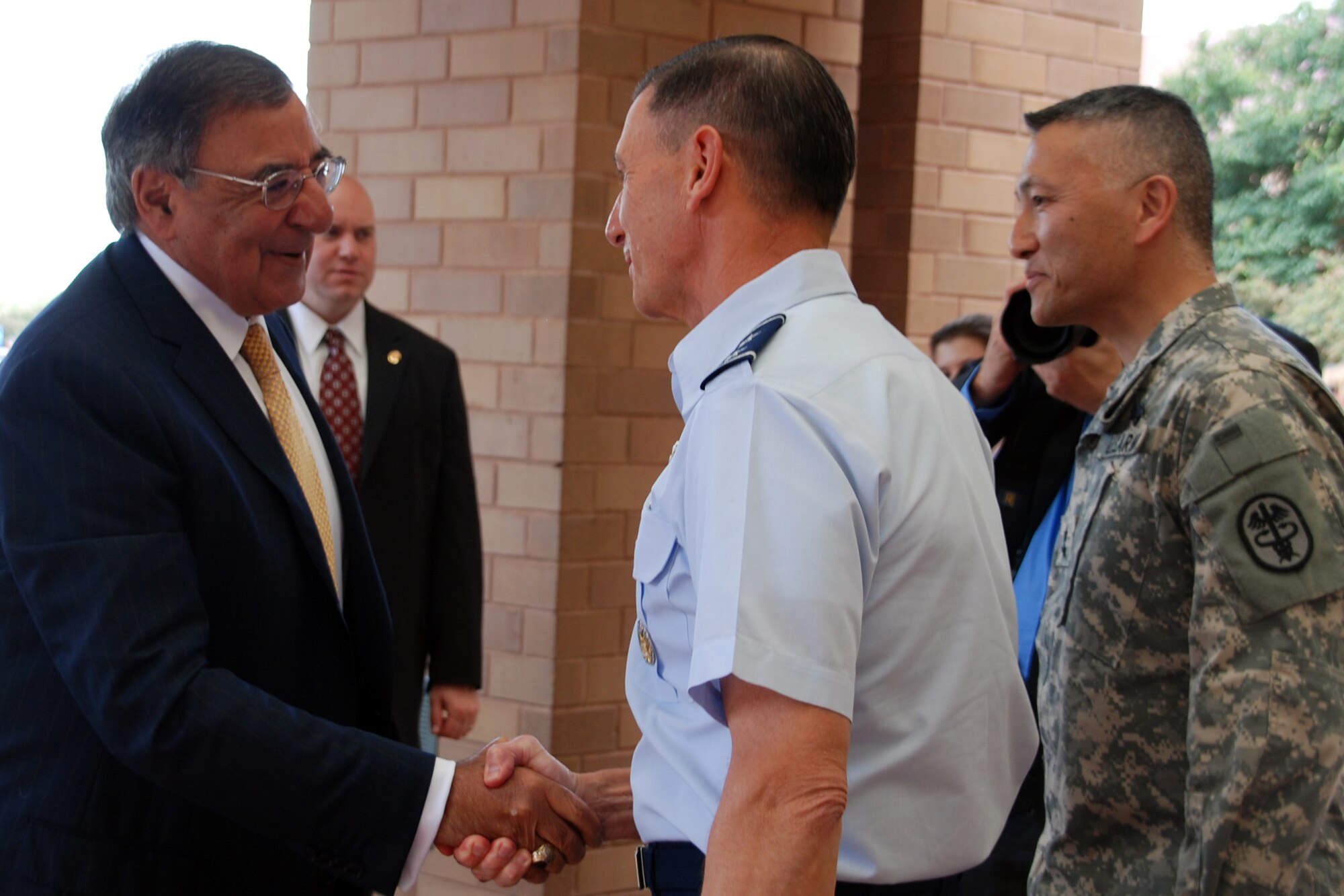 Defense Secretary Leon E. Panetta greets Air Force Maj. Gen. Byron Hepburn, director of the San Antonio Military Health System and commander, 59th Medical Wing and Maj. Gen. Ted Wong, commander, Brooke Army Medical Center at San Antonio Military Medical Center, June 27, 2012. Panetta spent the day visiting with wounded warriors at the Center for the Intrepid and SAMMC, thanking each troop and their families for their service and sacrifice.( U.S. Army photo/ Maria Gallegos)
