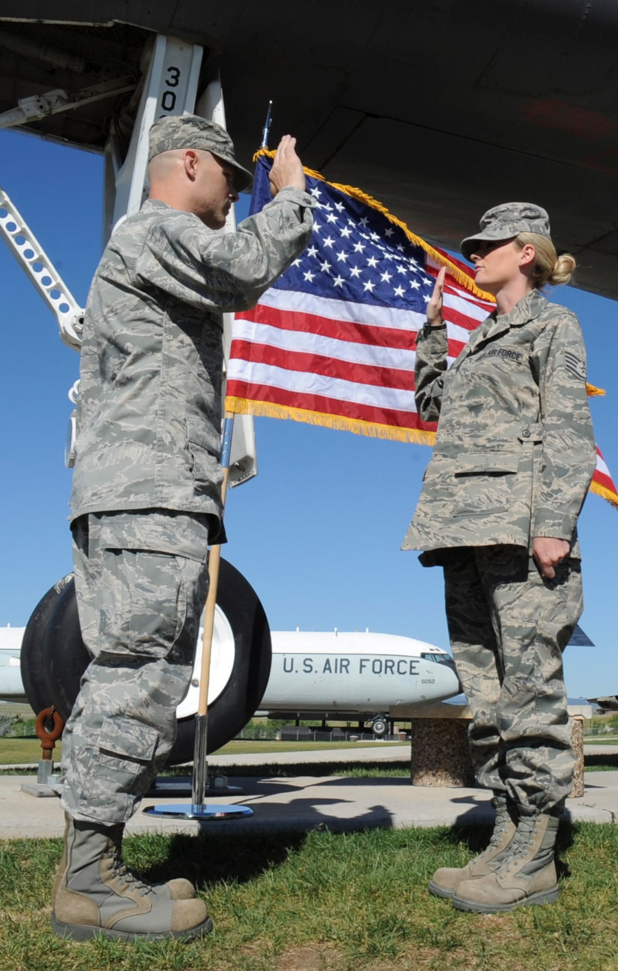 Maj. Nicholas Pedersen, 28th Maintenance Squadron commander, re-enlists his sister, Staff Sgt. Christine Green, 28th Logistics Readiness Squadron NCO in charge of inventory, at the South Dakota Air and Space Museum in Box Elder, S.D., June 21, 2012. Pedersen considers it a great honor to have the opportunity to participate in such an important event in his sister’s life. (U.S. Air Force photo by Airman 1st Class Anania Tekurio/Released) 