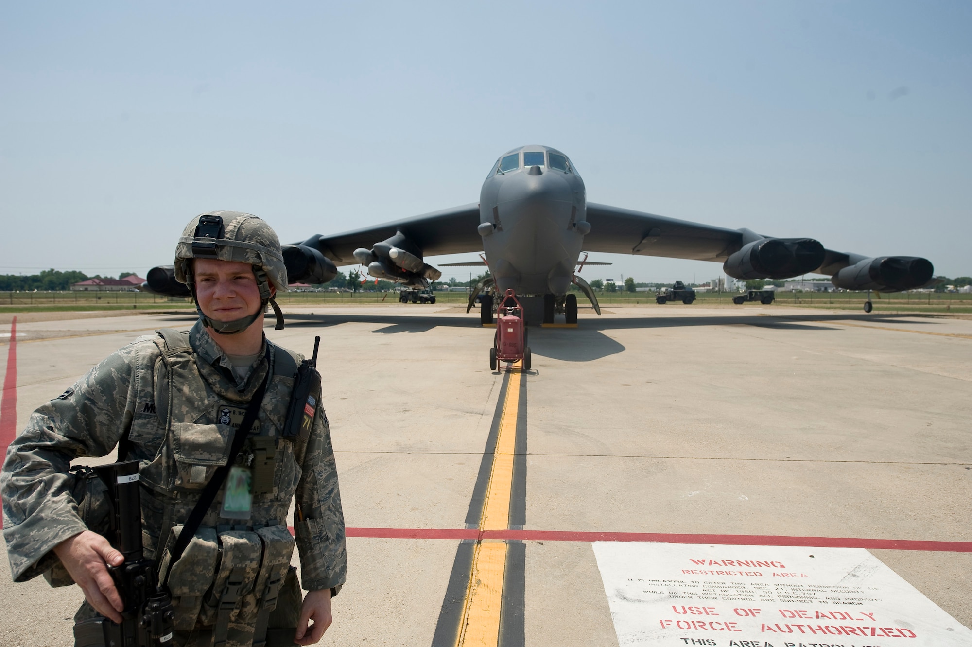 Airman 1st Class Brian McMaster, 2nd Security Forces Squadron, guards a B-52H Stratofortress during a training scenario at Barksdale Air Force Base, La., June 26. The scenario was part of a Nuclear Surety Exercise designed to test the wing's ability to maintain control of strategic assets. (U.S. Air Force photo/Staff Sgt. Chad Warren)(RELEASED)