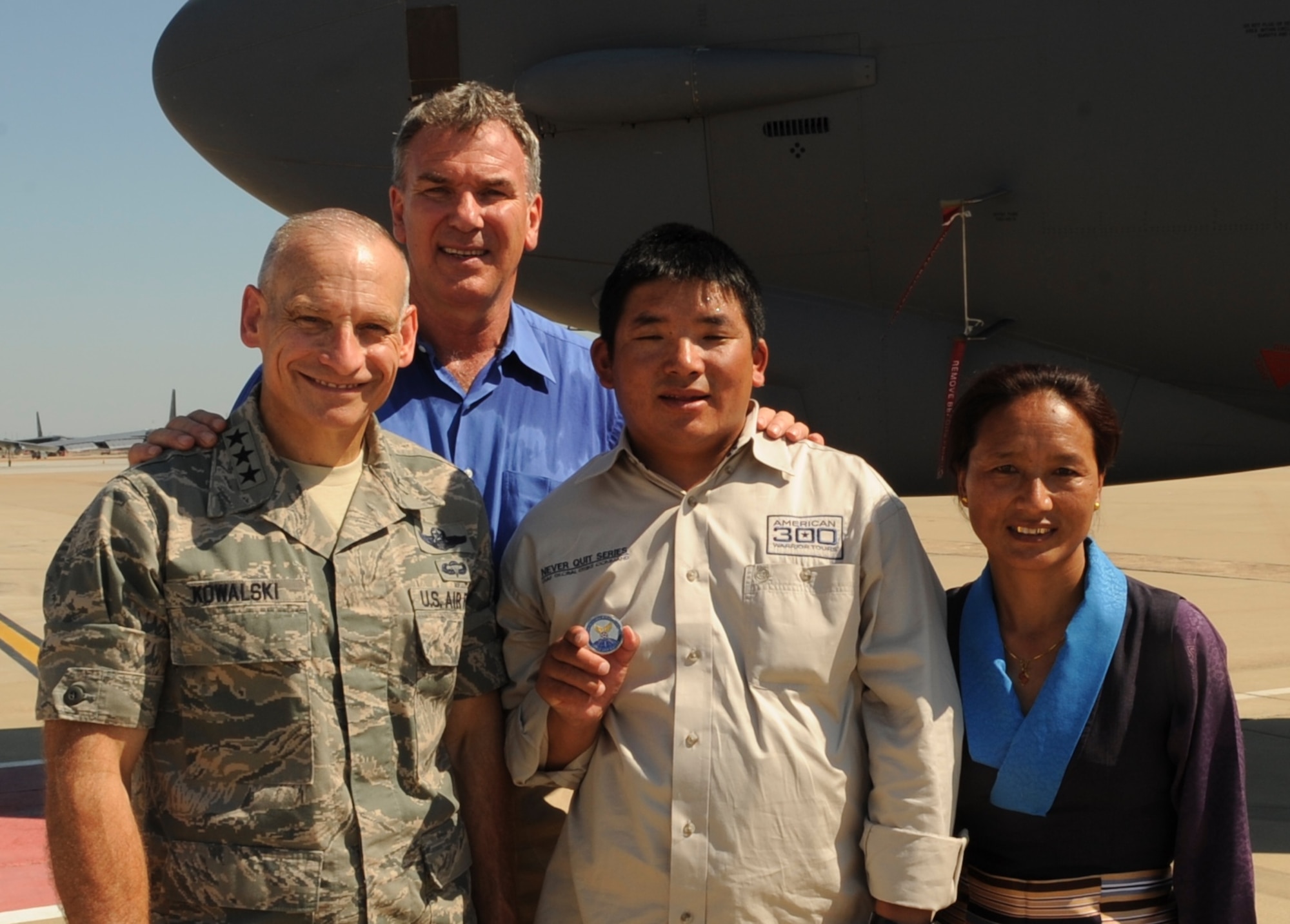 Chhiring Dorje Sherpa and his wife Dawa, stand alongside Tom Whittaker and Commander of Air Force Global Strike Command, Lt. Gen. Jim Kowalski, following the ceremony here, June 27.  During the ceremony, Sherpa presented a special U.S.-Air Force Global Strike Command flag to the command.  Sherpa had personally carried the flag to the summit of Mount Everest in honor of Global Strike Command Airmen (U.S. Air Force photo by Airman 1st Class Joseph A. Pagán Jr.).  