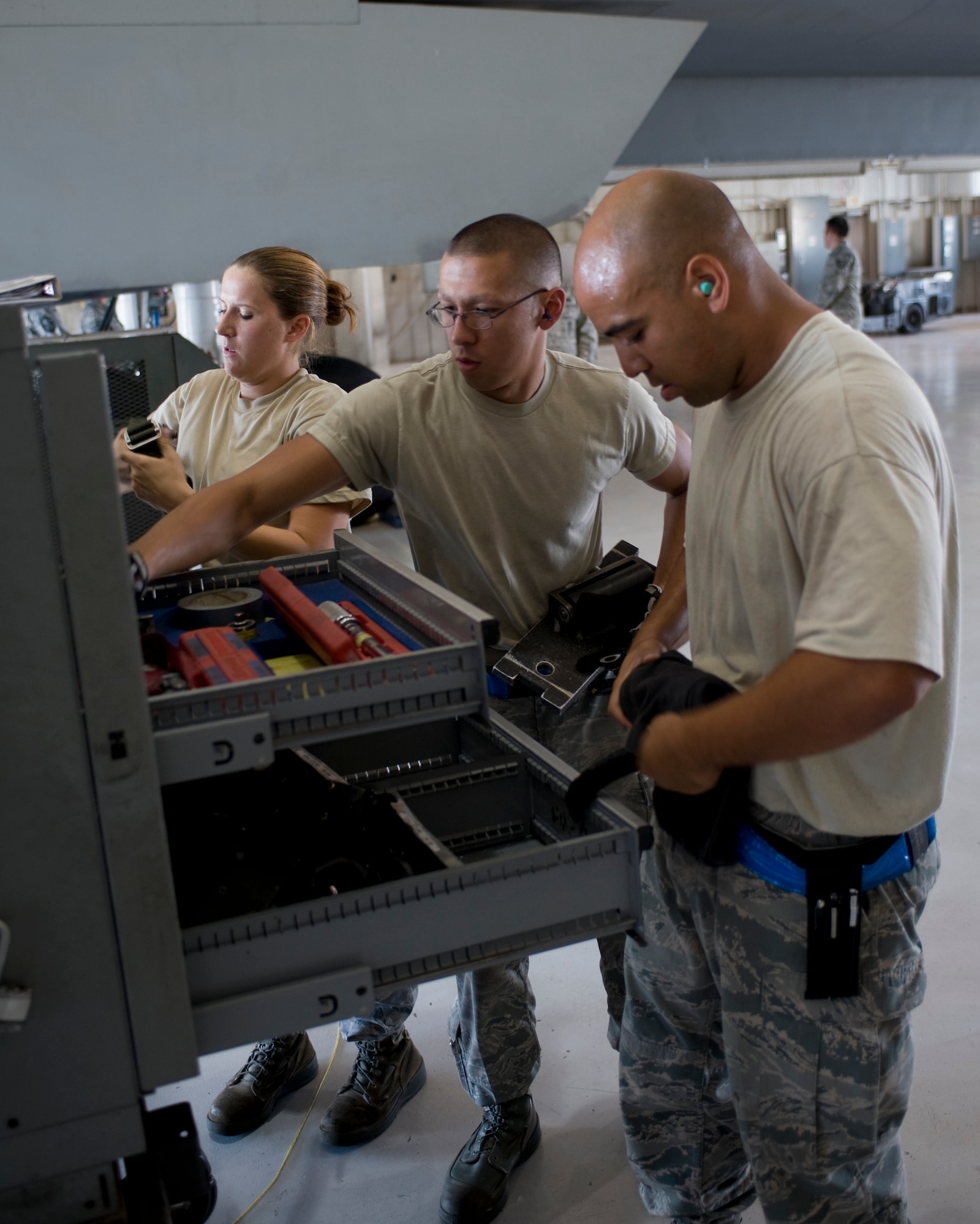 7th Aircraft Maintenance Squadron B-1 weapons load crew team members inventory a composite tool kit during the Weapons Load Crew of the Quarter competition held at the load crew training facility June 28, 2012, at Dyess Air Force Base, Texas. The competition was comprised of a dress and appearance inspection, physical fitness test and a timed weapons loading evaluation. (U.S. Air Force photo by Staff Sgt. Richard P. Ebensberger/ Released)