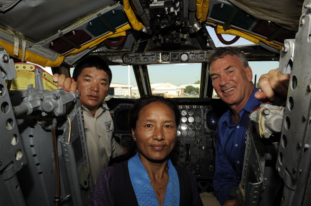 Chhiring Dorje Sherpa and his wife Dawa, in addition to Tom Whittaker, tour the interior of a B-52H Stratofortress Bomber during a visit to Barksdale Air Force Base, La. June 27.  Sherpa and Whittaker visited the base to present a special U.S. flag to Air Force Global Strike Command during a ceremony.  Sherpa had personally carried the flag to the summit of Mount Everest in honor of the Global Strike Command Airmen (U.S. Air Force photo by Airman 1st Class Joseph A. Pagán Jr.).