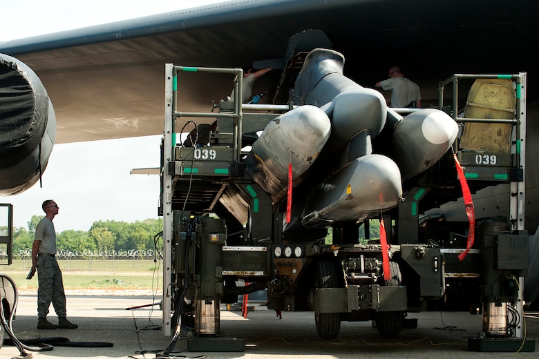 U.S. Air Force Tech. Sgt. Thomas Richey, 2nd Maintenance Group Loading Standardization Crew team chief, evaluates a 707th Maintenance Squadron weapons load crew during an Air Launched Cruise Missile loading operation on a B-52 Stratofortress, Barksdale Air Force Base, La., June 15, 2012. U.S. Air Force Master Sgt. James Hudson, Tech. Sgt. Don Ballard, Staff Sgt. Kyle Bailey and Senior Airman Erin Bernik, are the first nuclear certified weapons load crew in the Air Force Reserve Command. (U.S. Air Force photo by Master Sgt. Greg Steele/Released)