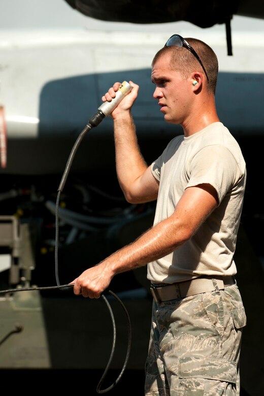 U.S. Air Force Staff Sgt. Matthew Bailey, 707th Maintenance Squadron weapons loader, operates a Remote Stop Switch on a MHU-196 Munitions Trailer during an Air Launched Cruise Missile loading operation on a B-52H Stratofortress, Barksdale Air Force Base, La., June 15, 2012. During the loading operation, Bailey is responsible for ensuring safe clearance exists between the weapons package and the aircraft. (U.S. Air Force photo by Master Sgt. Greg Steele/Released)