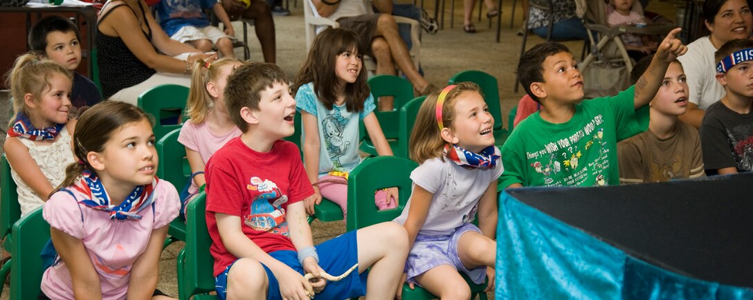Puppeteer Bob Brown entertains several children from Joint Base Andrews with one of his puppets during a skit at the Andrews Exceptional Family Member Program’s (EFMP) Summer Camp Experience held the Community Activity Center June 21.  The camp involved themed-based activities for the EFMP children and their siblings.  (Photo/Bobby Jones)
