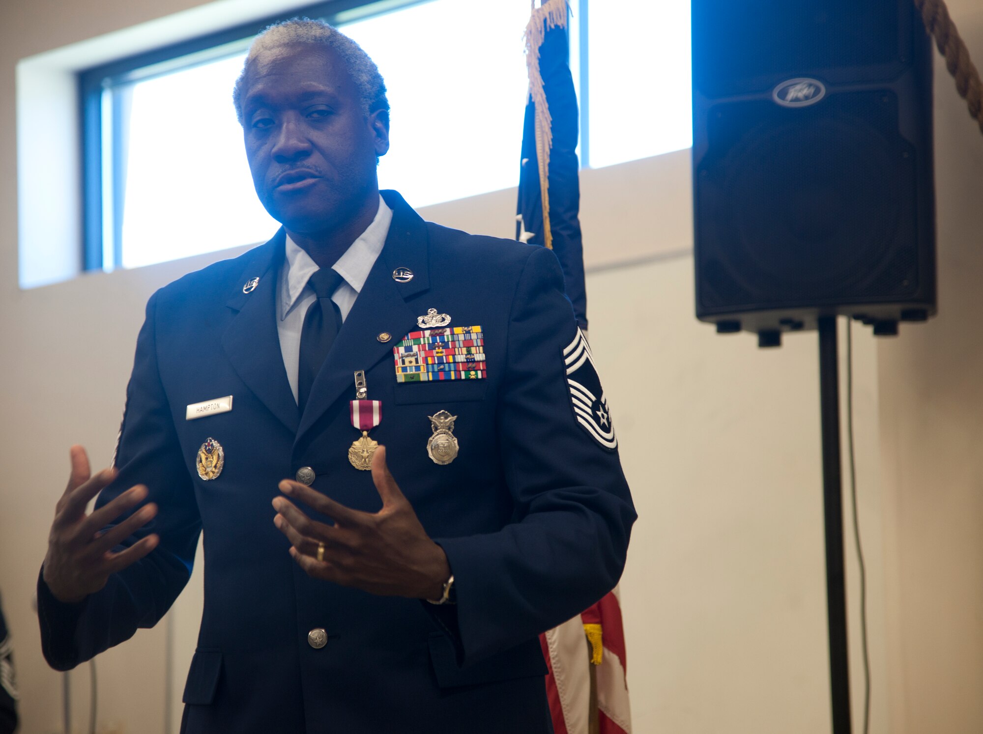 Retired U.S. Air Force Chief Master Sgt. John Hampton, Air Combat Command security forces manager, speaks about his career, at Moody Air Force Base, Ga., June 27, 2012.  Hampton gave thanks to everyone who helped him in his career and everyone who attended his retirement ceremony. Hampton is a former 823d Base Defense Squadron security forces manager and traveled from Langley Air Force Base, Va., to retire, because he said it felt like being home. (U.S. Air Force photo by Airman 1st Class Paul Francis/Released)
