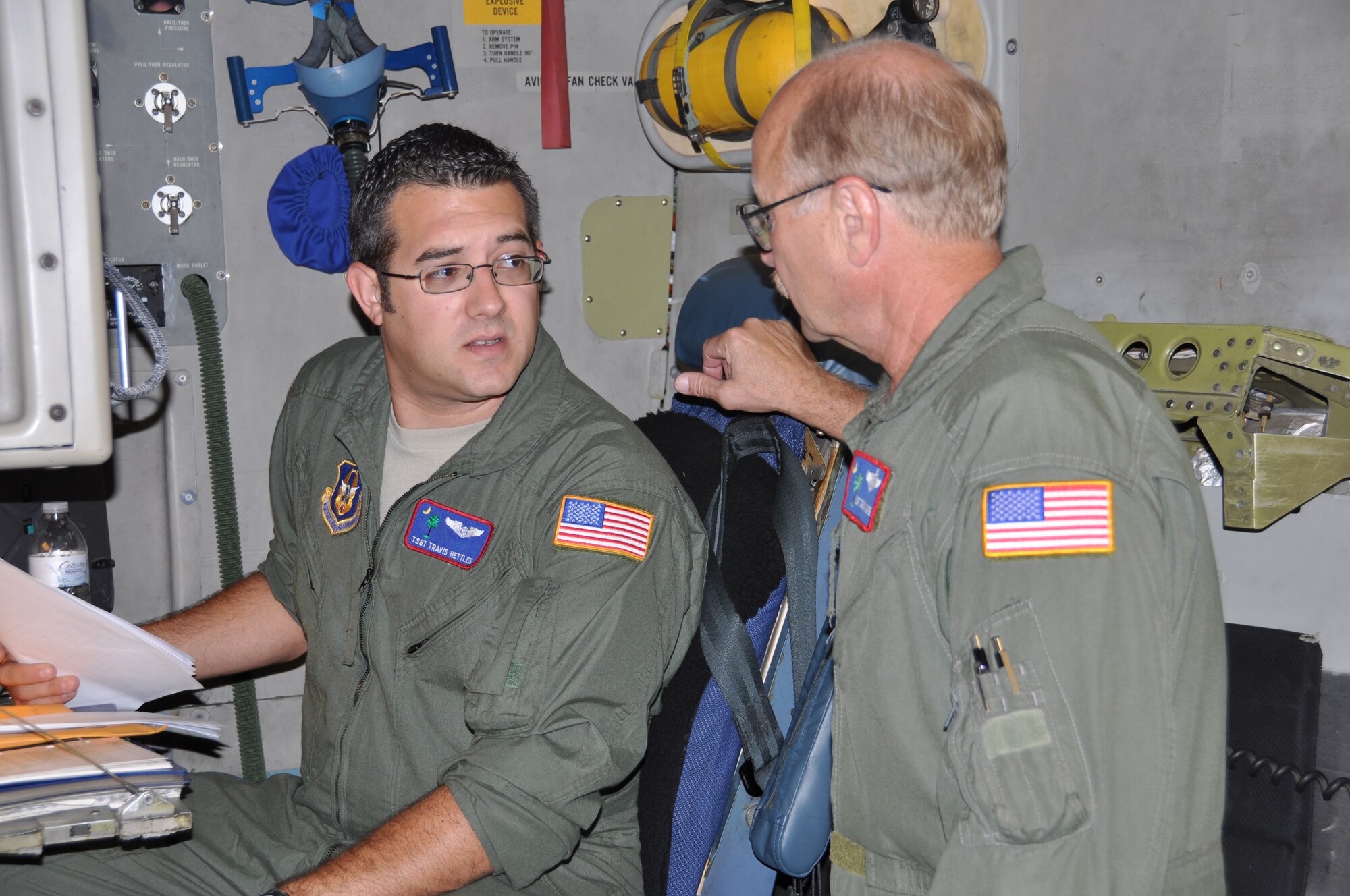 Tech. Sgt. Travis Nettles prepares to be evaluated during a no-notice spot evaluation by Master Sgt. Dennis Moore during a flight on a C-17 Globemaster III aircraft in Panama City, Panama June 22. The 315th Airlift Wing flight to Panama was part of a re-supply and training mission to South America. Nettles is a 701st Airlift Squadron instructor loadmaster, and Moore is a 701 AS Stan/Eval loadmaster. (U.S. Air Force Photo/Capt. Wayne Capps) 