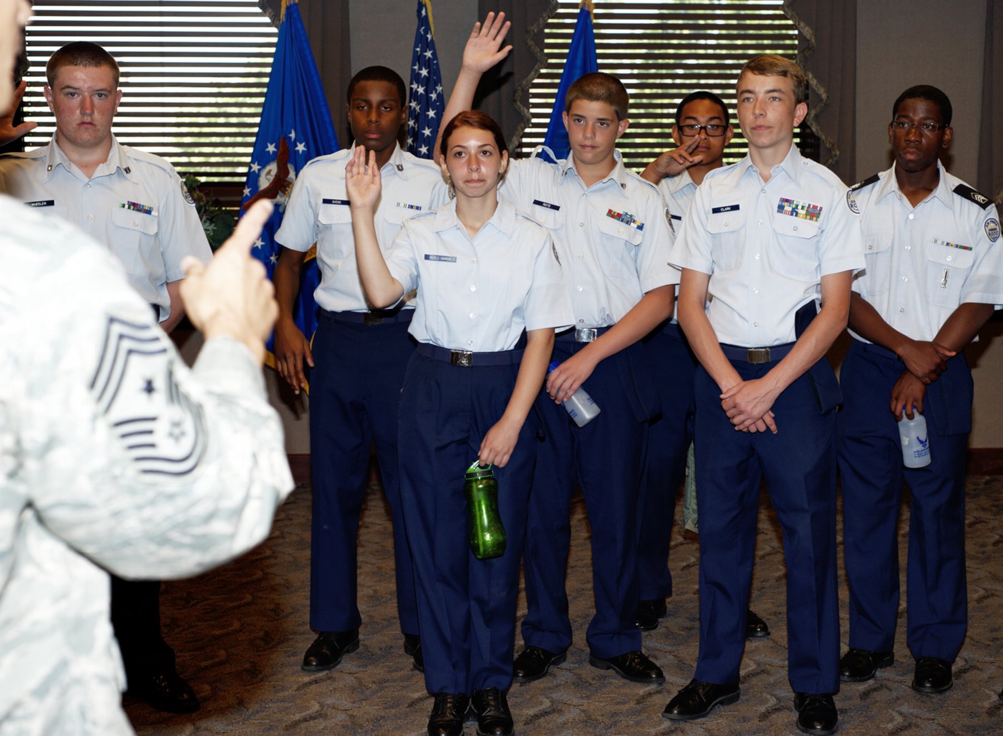 A group of Air Force JROTC cadets ask Chief Master Sgt. Richard Parsons, Air Combat Command command chief, questions about his experiences as an Airman during their visit to Langley Air Force Base, June 27, 2012.  The cadets, 87 in total, came to Langley during their summer leadership program to help prepare them for future leadership responsibilities. (U.S. Air Force photo by Tech. Sgt. Barry Loo/Released)