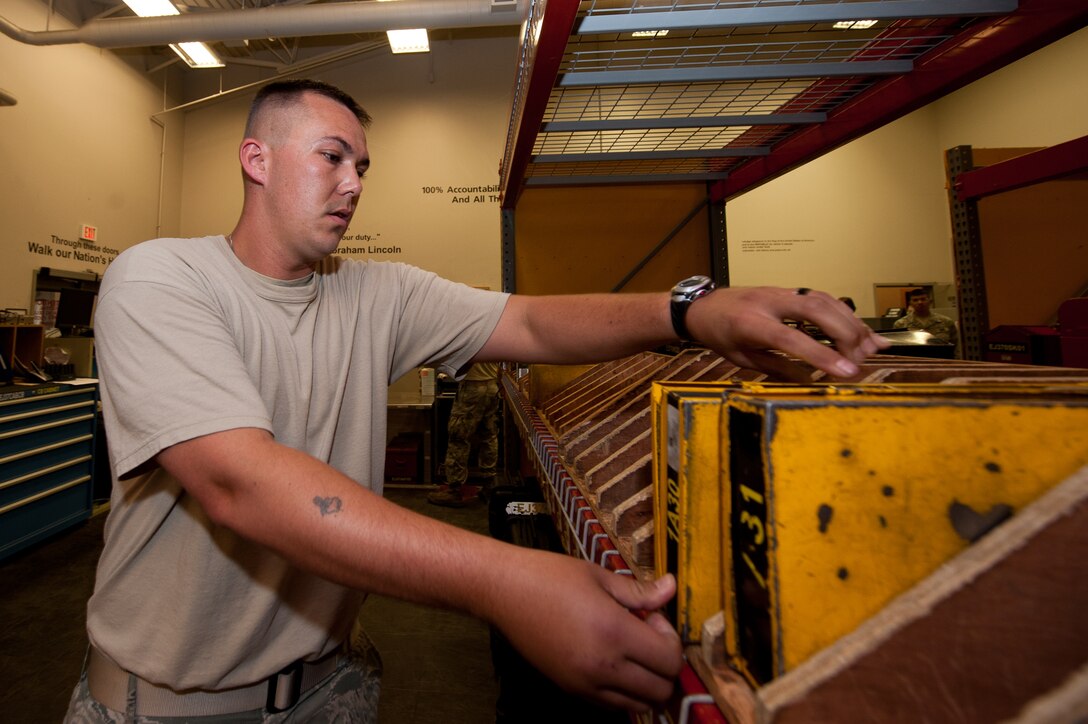 Staff Sgt. Scott Beckrich, 28th Aircraft Maintenance Squadron support section shift leader, stores maintenance equipment during an equipment check-in process in the maintenance support section on Ellsworth Air Force Base, S.D., June 26, 2012. All of the maintenance equipment is stored in specific areas to increase efficiency when finding and storing the equipment. (U.S. Air Force photo by Airman 1st Class Kate Thornton/Released)