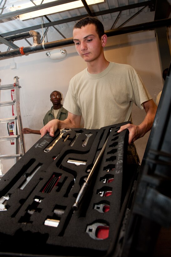Airman 1st Class Jonathan Balko, 28th AMXS electro-environmental systems apprentice, removes a layer of tools in a composite tool kit while checking in tools used during his shift in the maintenance support section on Ellsworth Air Force Base, S.D., June 26, 2012. Airmen inspect tools that they turn in to ensure all equipment is serviceable and accounted for. (U.S. Air Force photo by Airman 1st Class Kate Thornton/Released)
