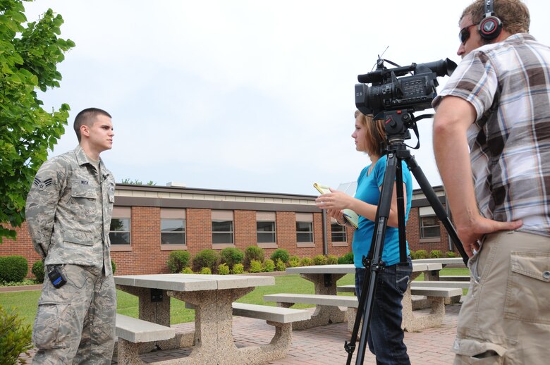 148th Fighter Wing member Senior Airman Eric Wick speaks with Dana Thayer during a press conference at the 148th Fighter Wing June 28, 2012.  Wick, along with approximately 300 Bulldogs, is slated to deploy to Kandahar Air Field, Afghanistan for about two months in support of Operation Enduring Freedom. (National Guard photo by Master Sgt. Ralph J. Kapustka.)