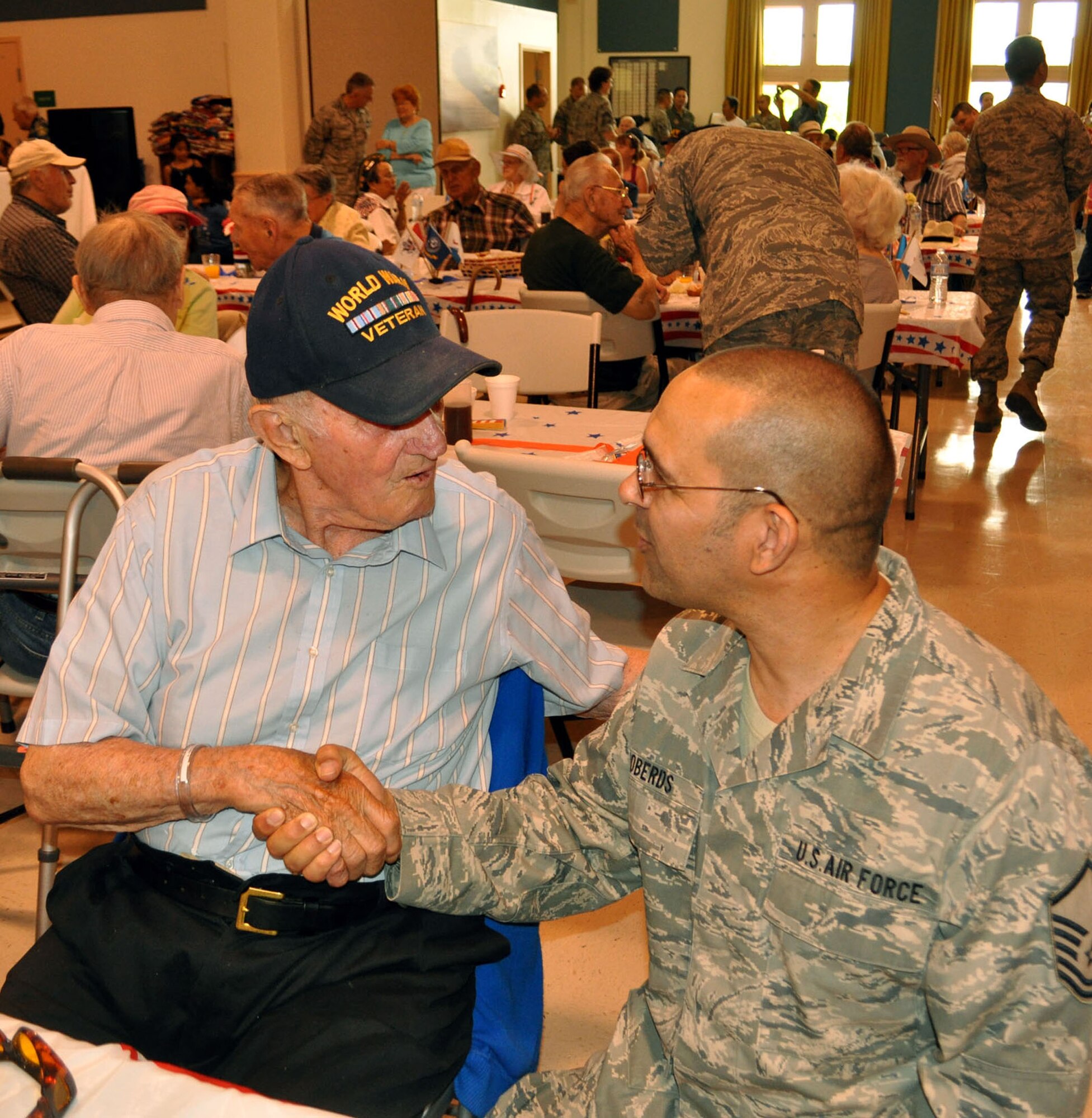 TRAVIS AIR FORCE BASE, Calif. -- MSgt. Richard Roberds, 349th Aerospace Medicine Squadron, thanks a veteran for paving the way for those of us still serving. (U.S. Air Force photo / Senior Master Sgt. Ellen Hatfield) 