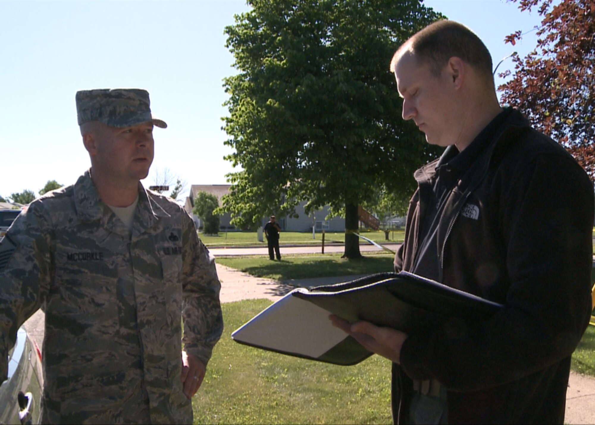 Master Sgt. Richard McCorkle, 319th Operations Support Squadron first sergeant, gets interviewed by Special Agent Shane Sailer during an exercise  June 21, 2012, on Grand Forks Air Force Base, N.D. (U.S. Air Force photo/Airman 1st Class Joshua Weaver)