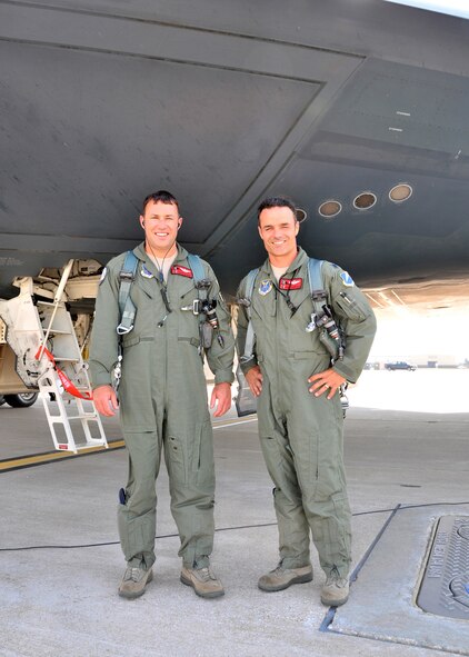 Lt. Col. Dave Thompson with co-pilot Maj Jared Kennish, stands beneath the B-2 "Spirit of Ohio" after completing his 1000th flying hour in a B-2 Stealth Bomber, June 27.  Thompson joins an elite group, which includes his co-pilot Maj Kennish  Just two weeks prior, Maj Geoffrey Billingsley flew past the 1000 flying hour mark.    Only 31 pilots have ever reached 1000 B-2 hours, and just thirteen still actively fly the B-2 Stealth Bomber.  Seven of these elite pilots are 131st Bomb Wing Missouri Air National Guard members at Whiteman Air Force Base:  Lt. Col. Rhett Binger,  Lt. Col. Mike Pyburn, Lt. Col. Dave Thompson,  Maj. Jared Kennish, Maj. John Avery,  Maj. Geoffrey Billingsley, and Lt. Col. Mike Means, who has over 1500 B-2 flying hours.(National Guard Photo by Senior Master Sgt. Mary-Dale Amison.  RELEASED)