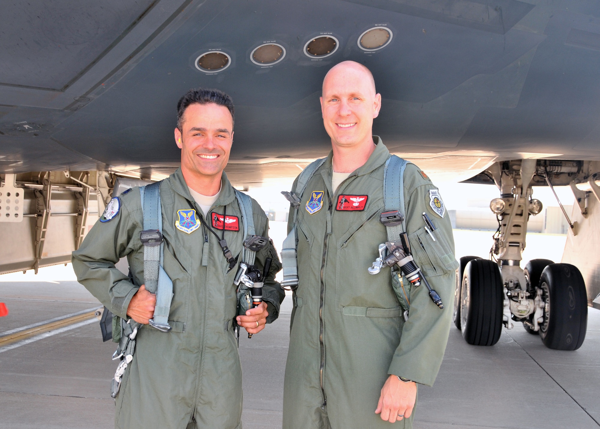 Lt. Col. Dave Thompson stands with Maj Geoffrey Billingsley under the B-2 "Spirit of Ohio," June 27.  Thompson just completed 1000 flying hours in the B-2 and Billingsley had achieved this mark just two weeks prior on June 13. Only 31 pilots have ever reached 1000 B-2 hours, and just thirteen still actively fly the B-2 Stealth Bomber.  Seven of these elite pilots are 131st Bomb Wing Missouri Air National Guard members at Whiteman Air Force Base:  Lt. Col. Rhett Binger,  Lt. Col. Mike Pyburn, Lt. Col. Dave Thompson,  Maj. Jared Kennish, Maj. John Avery,  Maj. Geoffrey Billingsley, and Lt. Col. Mike Means, who has over 1500 B-2 flying hours. (National Guard Photo by Senior Master Sgt. Mary-Dale Amison.  RELEASED)