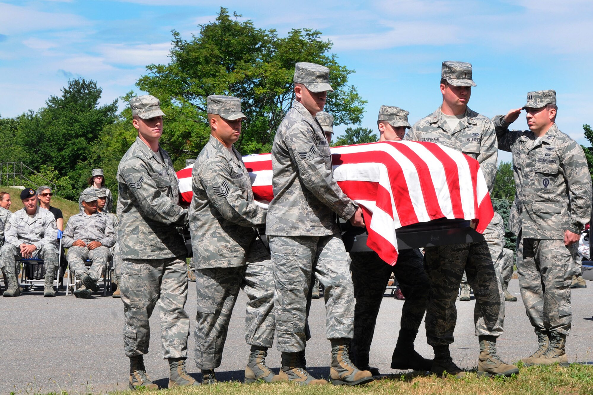 HANSCOM AIR FORCE BASE, Mass. – Airmen demonstrate funeral honors during U.S. Honor Guard formal training course graduation ceremony outside the Patriot Honor Guard building June 27. A total of 22 ceremonial honor guardsmen from throughout the region attended the week and half course to learn about the firing party, pall bearing and colors sequence. (U.S. Air Force photo by Linda LaBonte Britt)