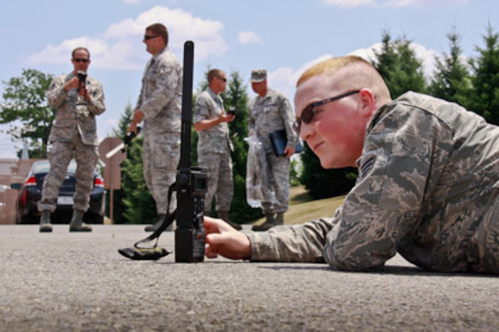 Senior Airman Nathan Keene, aircrew flight equipment technician attached to the 911th Airlift Wing, Operations Support Squadron, reads an encrypted text message on his Combat Survivor Evader Locator radio during a joint training exercise, here, June 27, 2012. Keene is partaking in this joint CSEL radio training program together with other participating Operation Support Squadrons such as the 171st Air Refueling Wing from Pittsburgh, Pa., the 914th Airlift Wing from Niagara Falls, N.Y., the 910th Airlift Wing from Youngstown, Pa., and the 4th Fighter Wing from Goldsboro, N.C.  The CSEL radio is critical for aircrew members to use because of the global positioning and encrypted text systems that can signal any branch of the military in case of an emergency, which makes this system a vital piece of equipment for deployed military members during any combat mission. (U.S. Air Force photo by Airman 1st Class Justyne Obeldobel/Released)