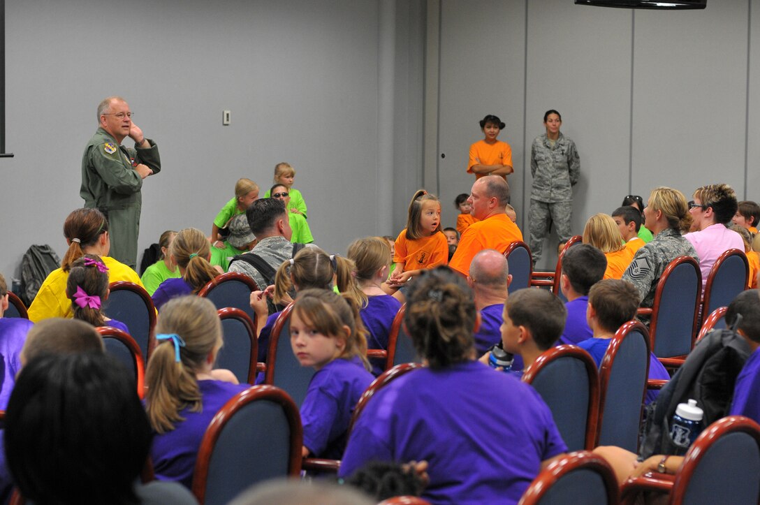 Colonel Dave Reynolds, Vice Commander, 126th Air Refueling Wing, Scott AFB, Ill., fields questions during an in-brief to children participating in the wing's annual Kids on Guard day held on June 26, 2012.  Each year the event allows Air National Guard members the opportunity to give their children a glimpse into military life.  Activities throughout the day included a military working dog demonstration, a tour of a KC-135R Stratotanker, a medical hands-on simulation, disaster response training and the G.I. Challenge obstacle course.  (National Guard photo by Master Sgt. Ken Stephens.)