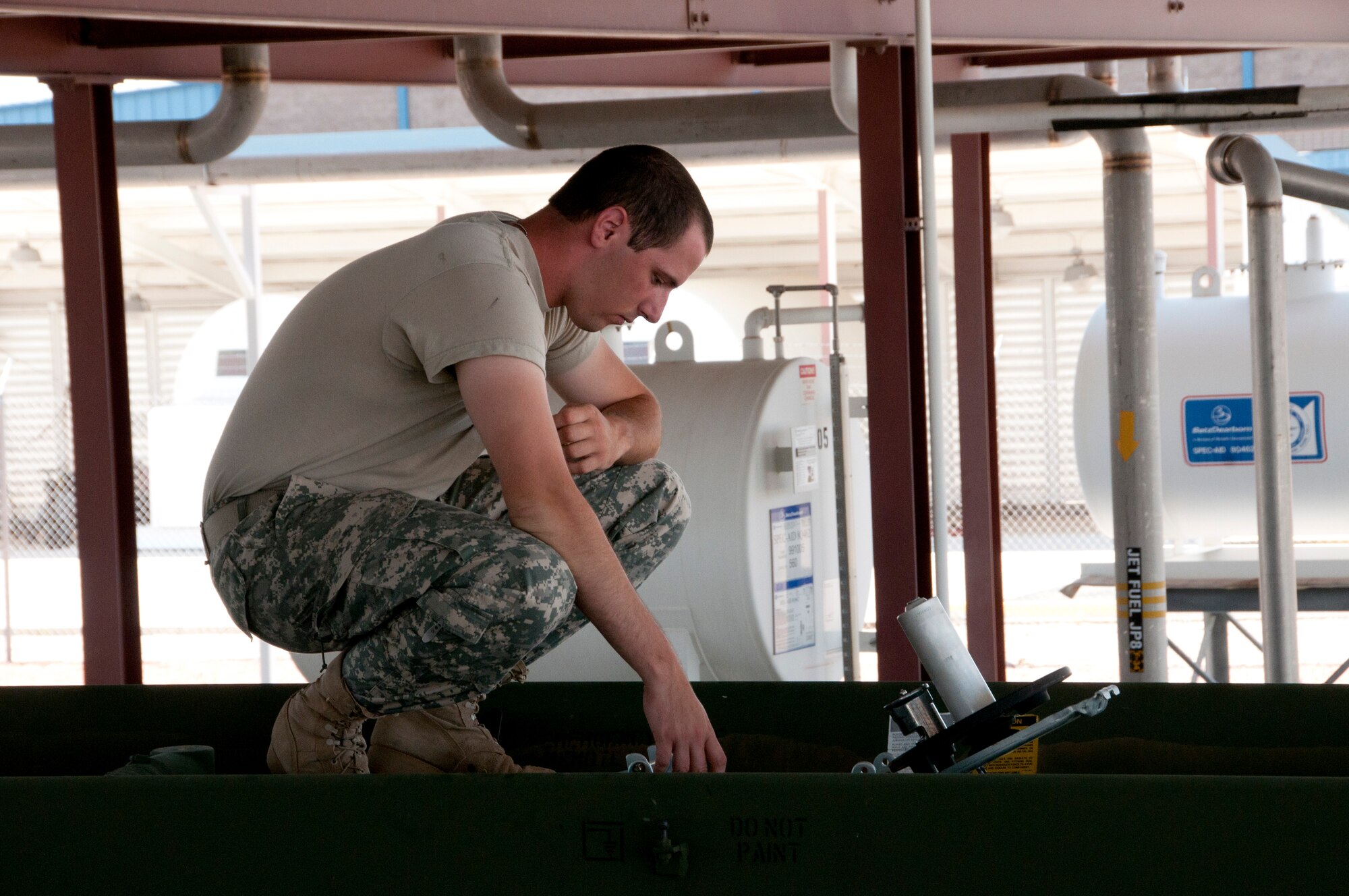 Army Reserve Pvt. Jacob Clune verifies that a fuel tanker is empty after making a delivery to the Arizona Air National Guard’s 162nd Fighter Wing at Tucson International Airport, June 21. Soldiers delivered fuel to 73 F-16 Fighting Falcons here for two weeks as part of their annual Quartermaster Liquid Logistics Exercise. (U.S. Air Force photo/Master Sgt. Dave Neve)