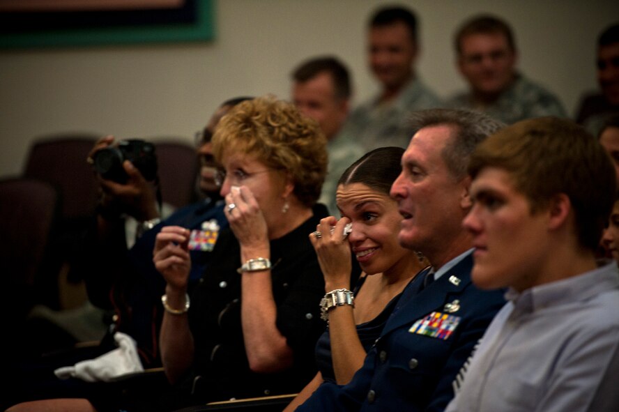 The mother and sister of U.S. Air Force Staff Sgt. Johnnie Yellock, a combat controller with the 23rd Special Tactics Squadron, wipe away tears during a Bronze Star Medal presentation for Yellock, June 26, 2012 at Hurlburt Field, Fla.  Yellock received the Bronze Star for his deployment to Afghanistan in 2011 -- a deployment in which he was significantly wounded by an Improvised Explosive Device.  (U.S. Air Force photo by Staff Sgt. David Salanitri) 
