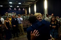Pat Forester hugs U.S. Air Force Staff Sgt. Johnnie Yellock Jr., a combat controller with the 23rd Special Tactics Squadron, during Yellock's Bronze Star Medal ceremony, June 26, 2012 at Hurlburt Field, Fla.  Mrs. Forester is the mother of Senior Airman Mark Forester, a combat controller who was fatally wounded in Afghanistan in 2010. (U.S. Air Force photo by Staff Sgt. David Salanitri) 