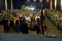 U.S. Air Force Staff Sgt. Johnnie Yellock, a combat controller with the 23rd Special Tactics Squadron, shakes hands with Lt. Col. Chris Larkin, 23 STS commander, during Yellock's Bronze Star Medal presentation, June 26, 2012 at Hurlburt Field, Fla. Yellock received the Bronze Star for his deployment to Afghanistan in 2011 -- a deployment in which he was significantly wounded by an Improvised Explosive Device. (U.S. Air Force photo by Staff Sgt. David Salanitri) 