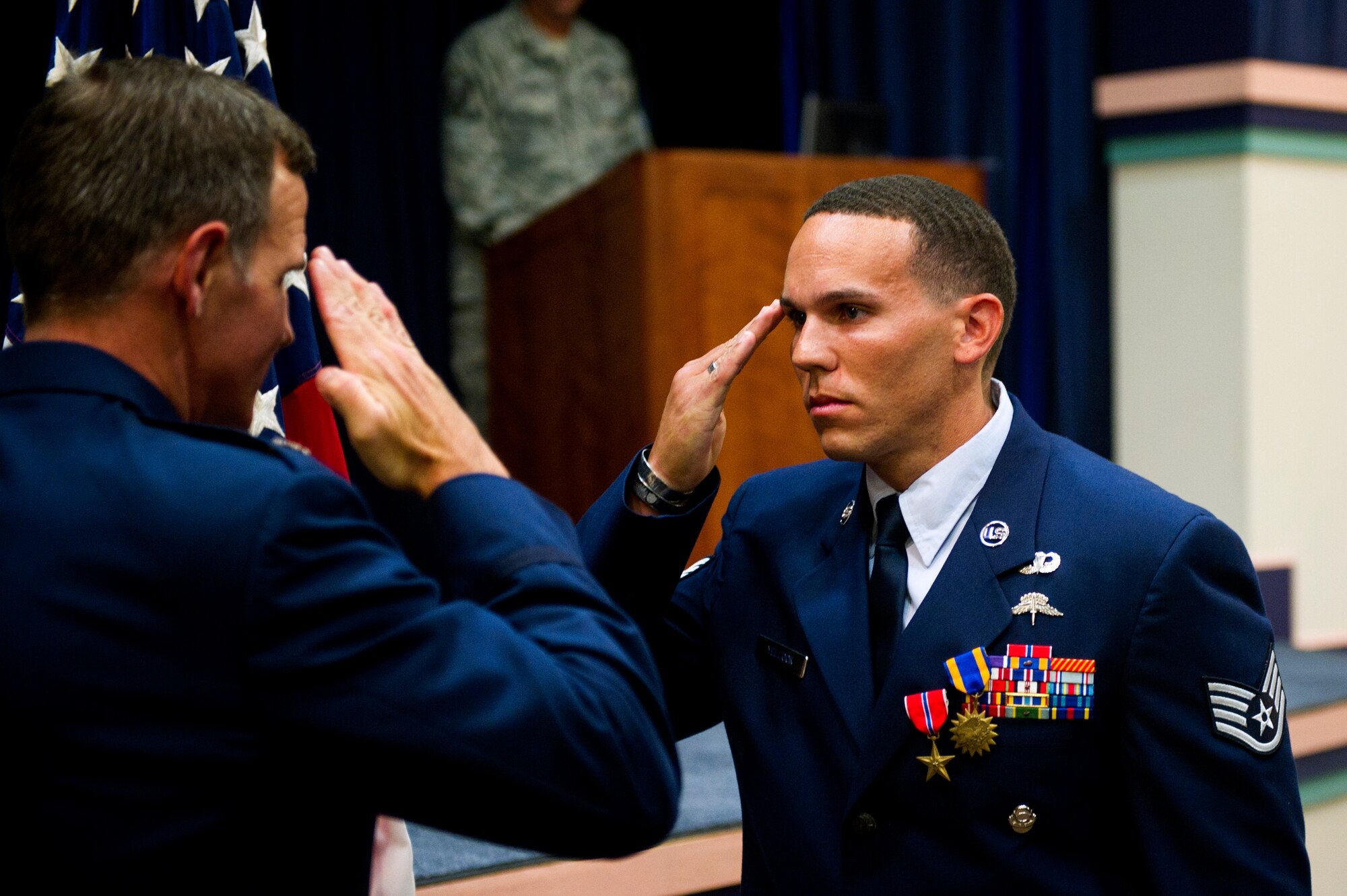 From right, U.S. Air Force Staff Sgt. Johnnie Yellock, a combat controller with the 23rd Special Tactics Squadron, salutes Lt. Col. Chris Larkin, 23rd Special Tactics Squadron commander, at Hurlburt Field, Fla, June 26, 2012 during Yellock's Bronze Star Medal presentation. Yellock received the Bronze Star for his deployment to Afghanistan in 2011 -- a deployment in which he was significantly wounded by an Improvised Explosive Device. (U.S. Air Force photo by Staff Sgt. David Salanitri) 
