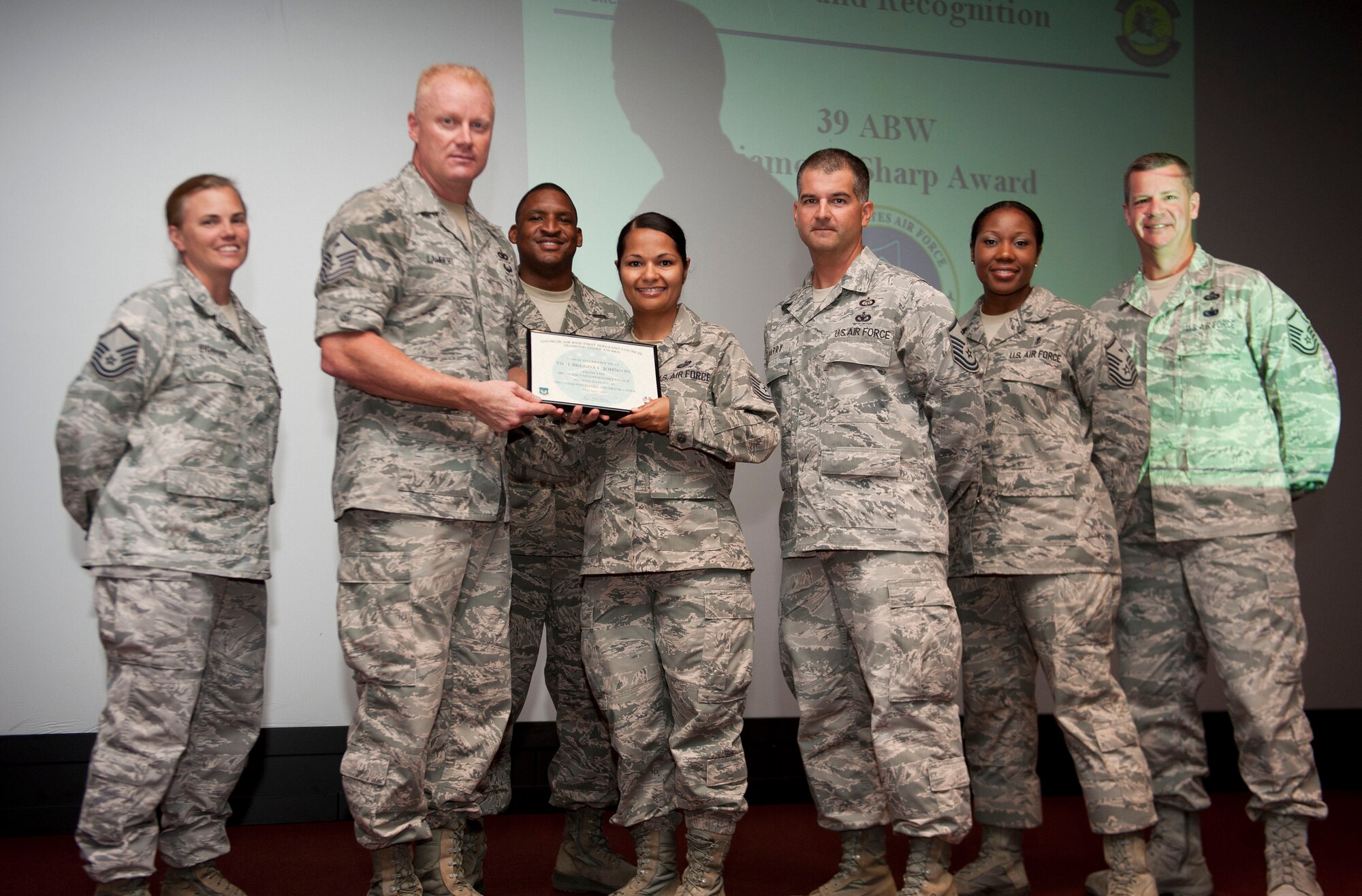 Tech. Sgt. Brenda Johnson, 90th Expeditionary Air Refueling Squadron, is presented the May 2012 Diamond Sharp Award by members of the Incirlik First Sergeant Council June 28, 2012, at Incirlik Air Base, Turkey. Johnson earned the award by distinguishing herself through outstanding professionalism, performance and display of the Air Force core values. (U.S. Air Force photo by Senior Airman Clayton Lenhardt/Released)