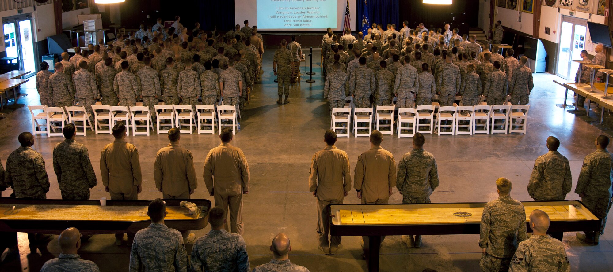 CAMP LEMONNIER, Djibouti – U.S. Air Force Lt. Gen. Craig Franklin, 3rd Air Force commander, and Airmen recite the Airman’s Creed during an Air Force Commander’s Call at the Morale, Welfare and Recreation’s building 11 Degrees North June 26, 2012.  Franklin visited Camp Lemonnier to meet with leadership of the Combined Joint Task Force – Horn of Africa as well as other U.S. Air Force assets and spoke to Airmen about how to make the most of their time while deployed to Africa. (U.S. Air Force photo by Senior Airman Lael Huss) 