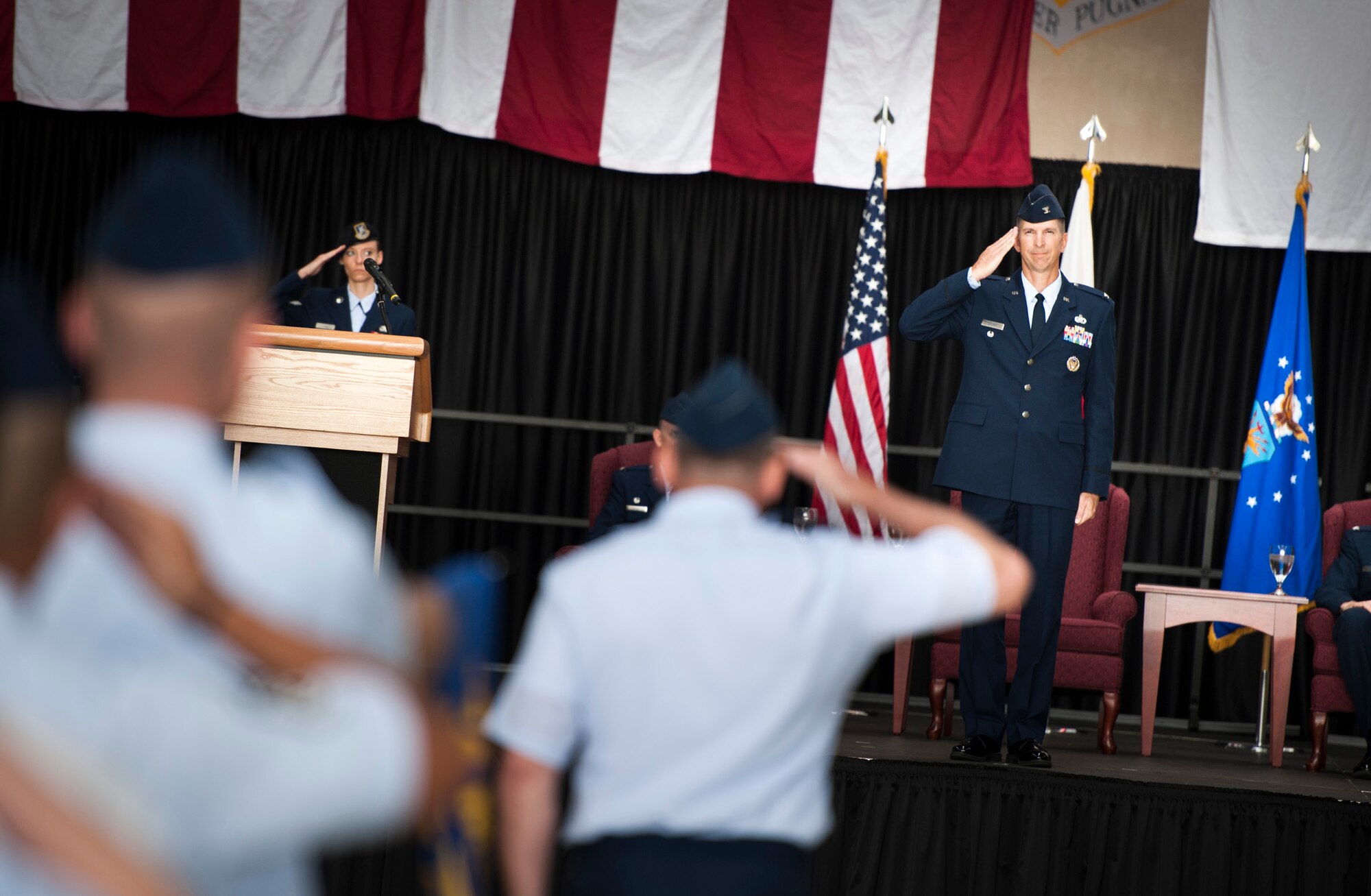 YOKOTA AIR BASE, Japan -- Members of the 374th Mission Support Group render a welcoming salute to their new commander, Col. Edward Brown, right, at the end of the 374th Mission Support Group change of command ceremony at Yokota Air Base, Japan, on June 27, 2012. This is Brown's sixth assignment to Japan. (U.S. Air Force photo by Tech. Sgt. Samuel Morse)